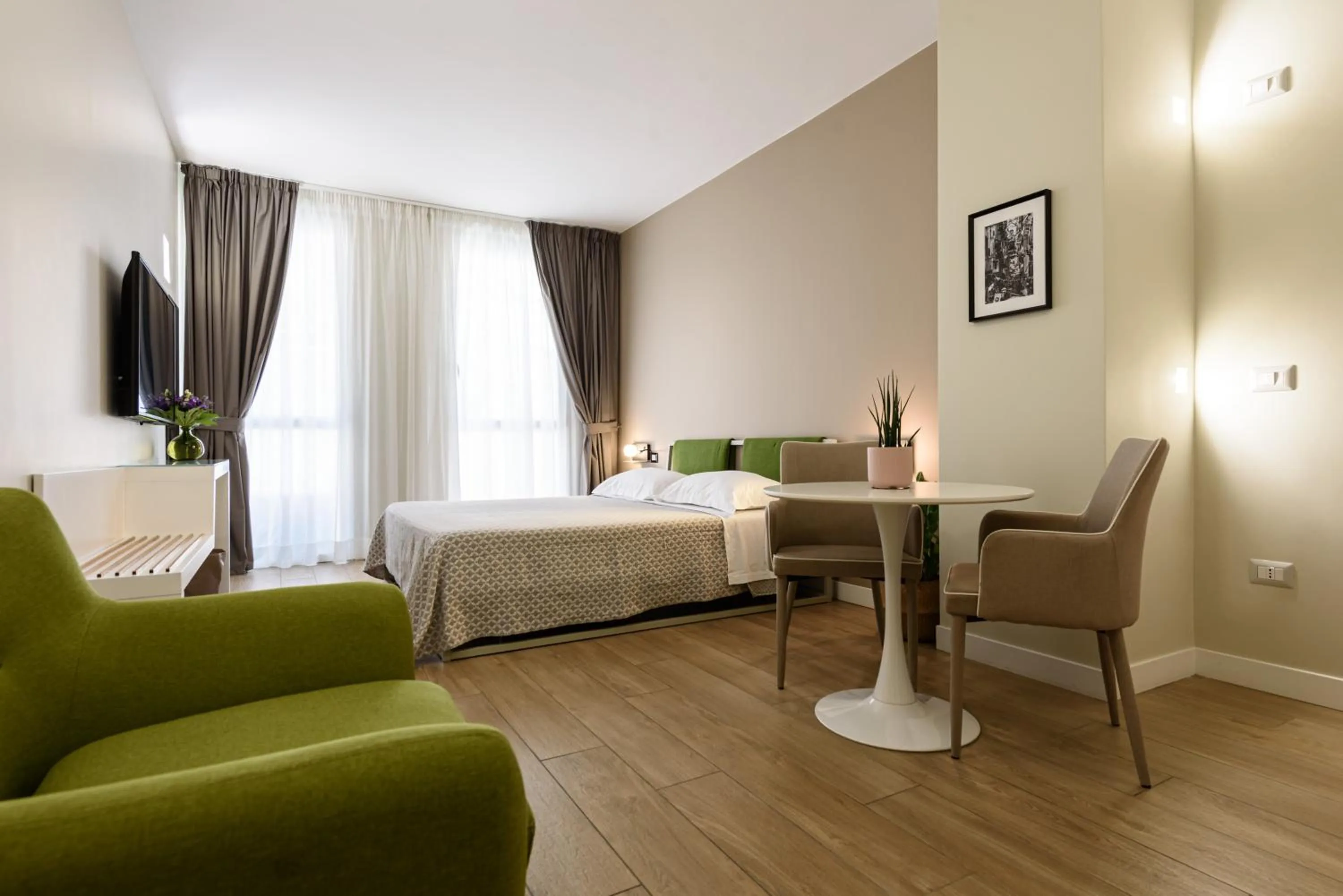 Photo of the whole room, Bed in Alma Suites