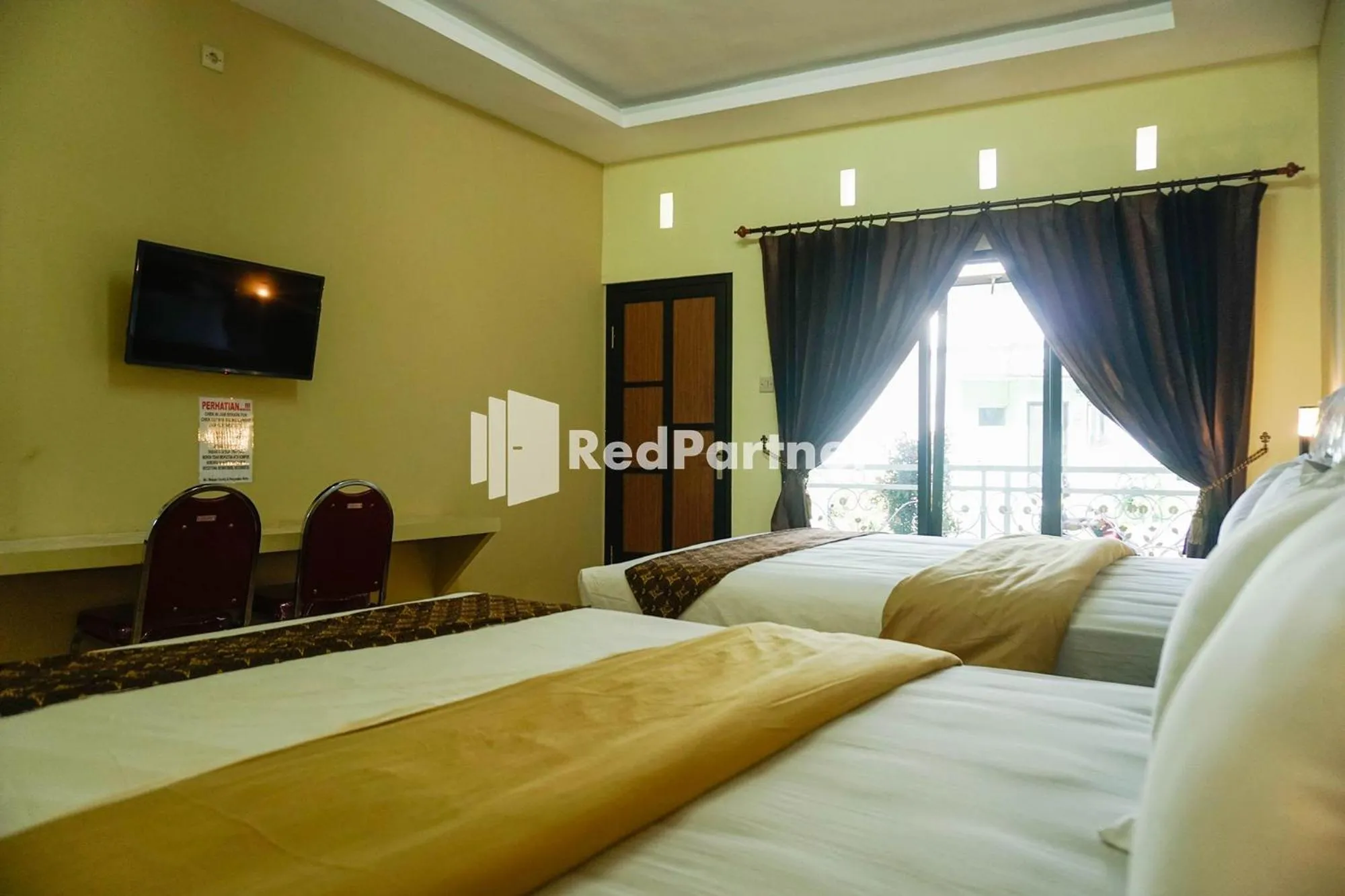 Bed in Griya Imafa Inn RedPartner near Jatim Park 2