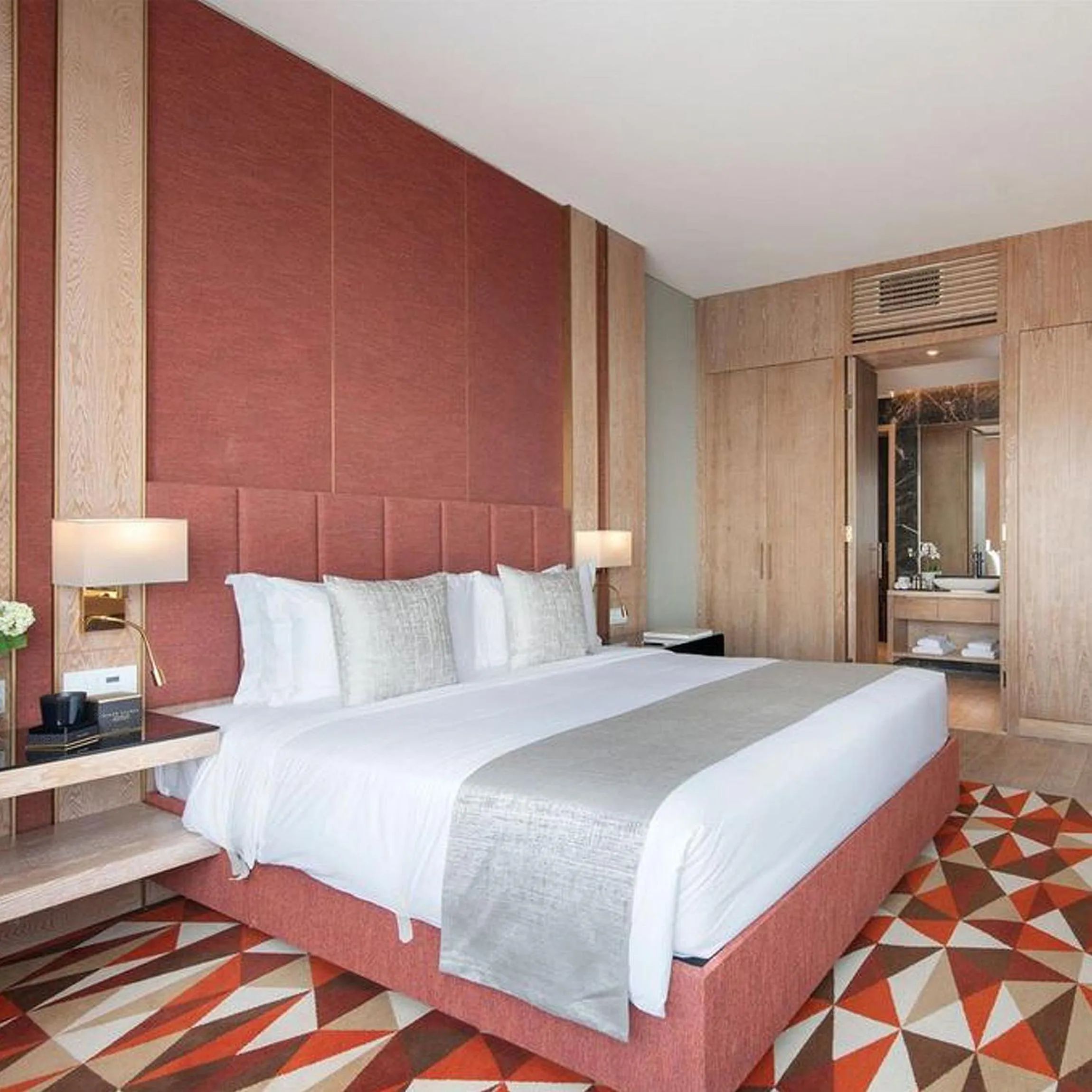 Bed in The Bentley Luxury Hotel & Suites