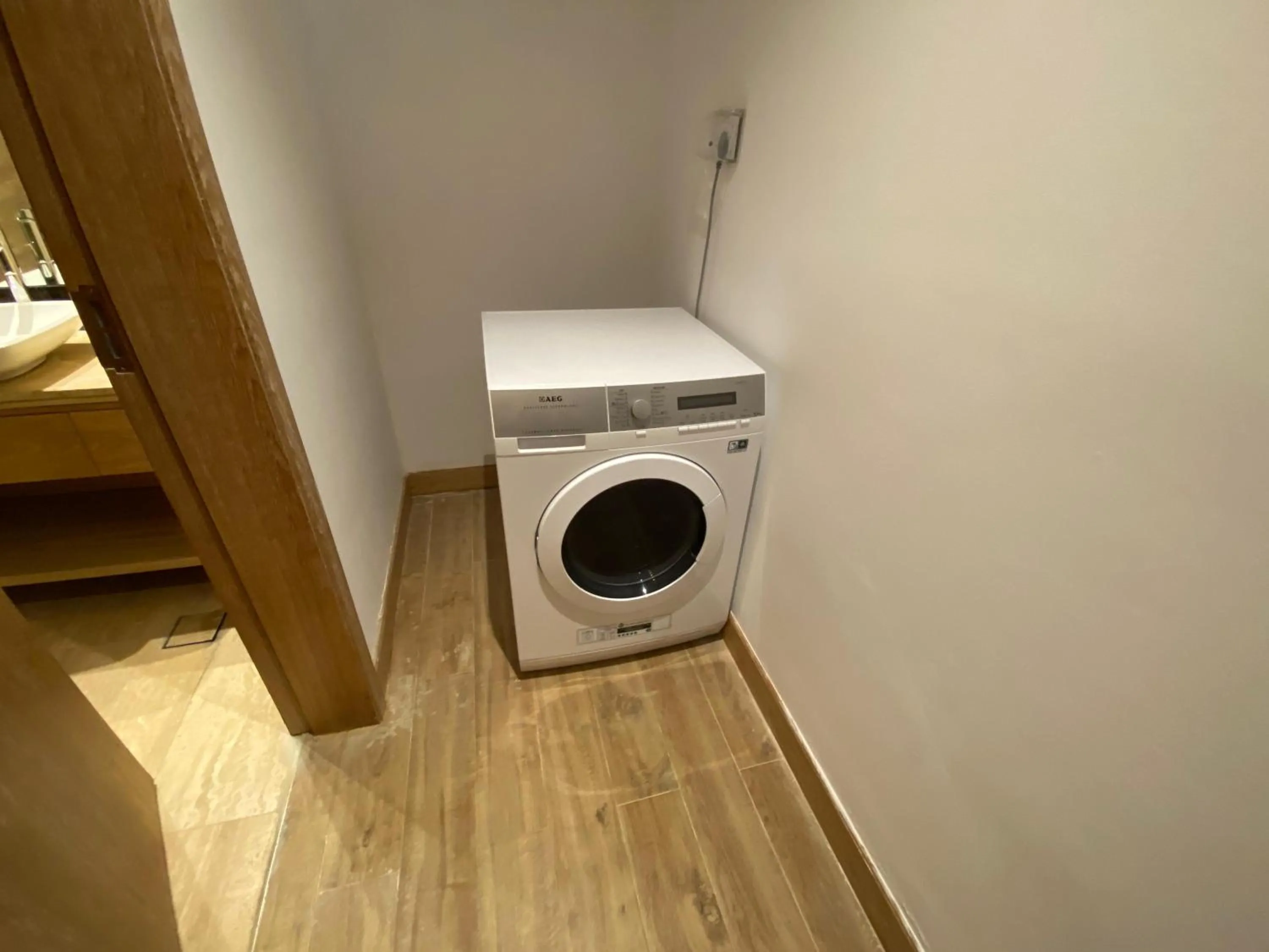 washing machine in The Bentley Luxury Hotel & Suites