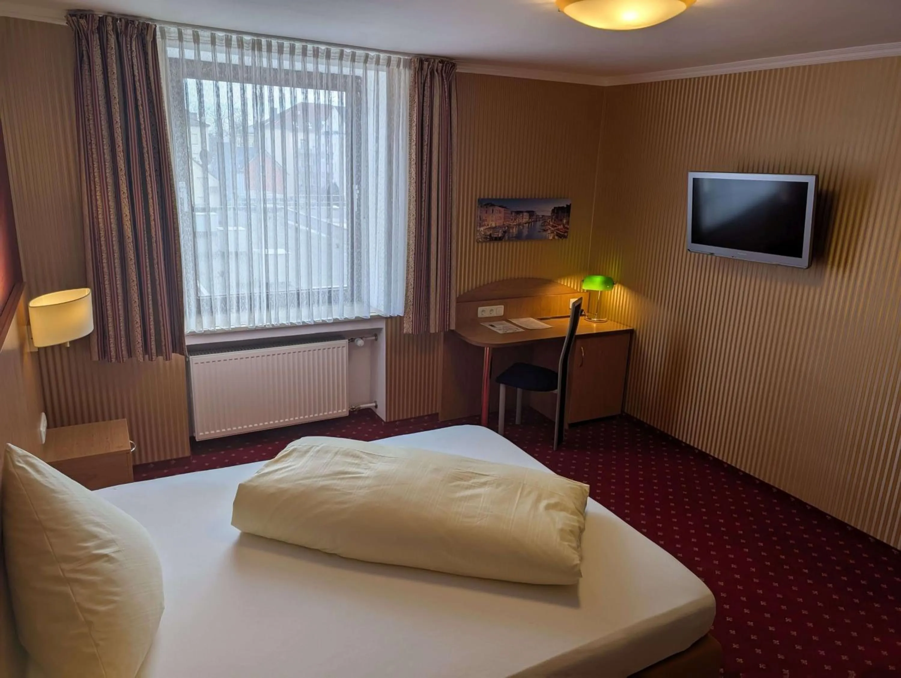 Bed in Stadthotel Augsburg