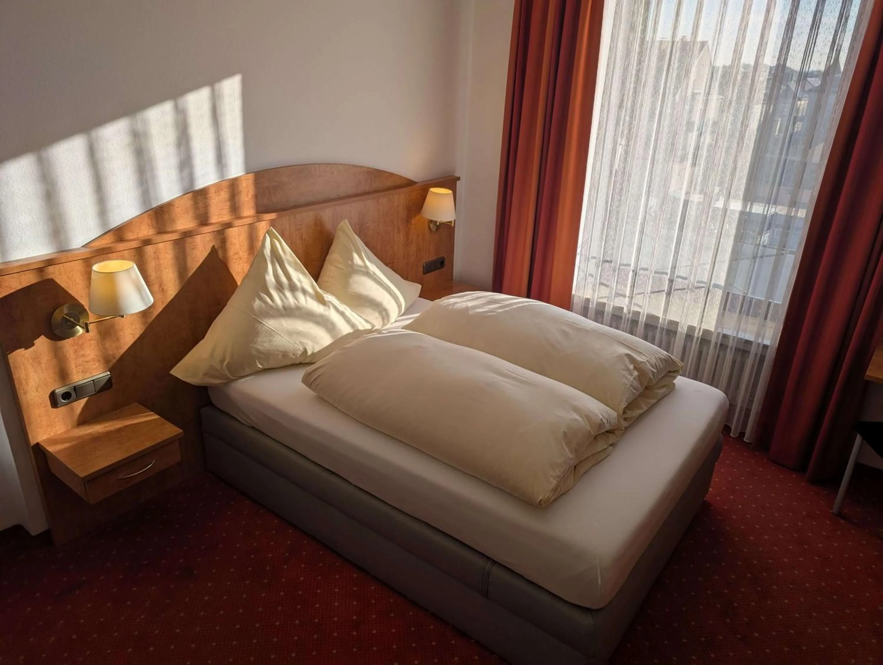 Bed in Stadthotel Augsburg