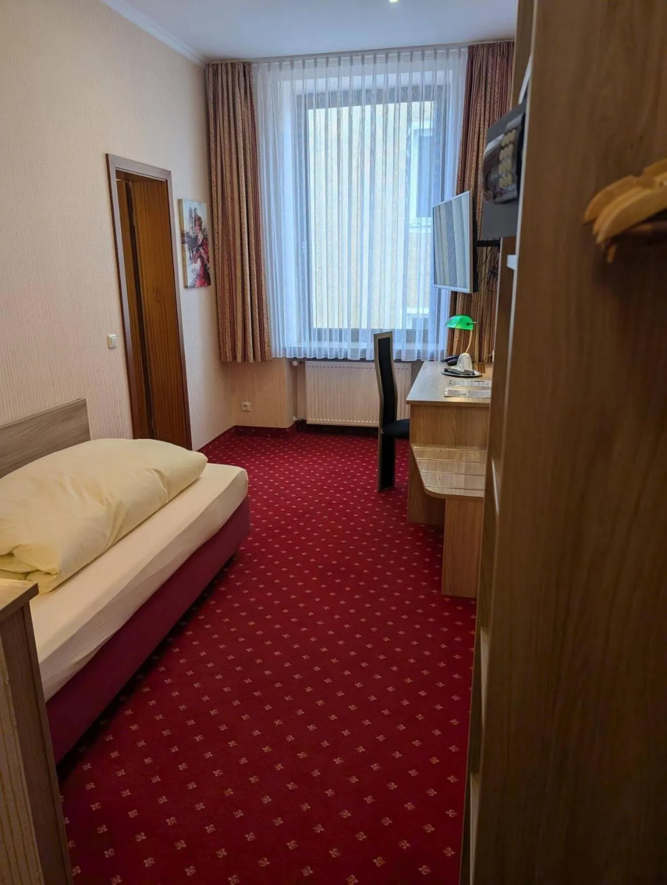 Photo of the whole room, Bed in Stadthotel Augsburg