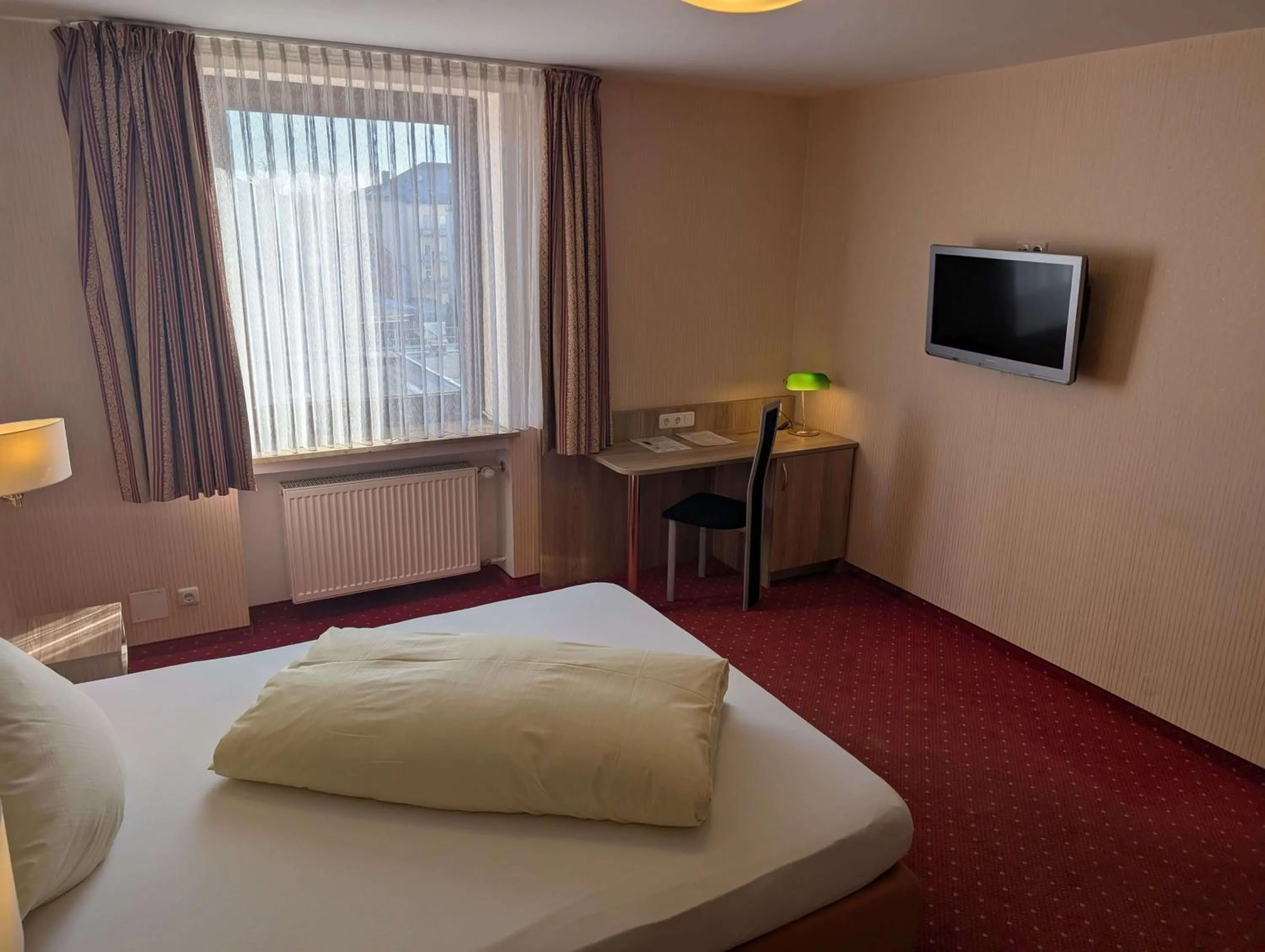 Bed in Stadthotel Augsburg