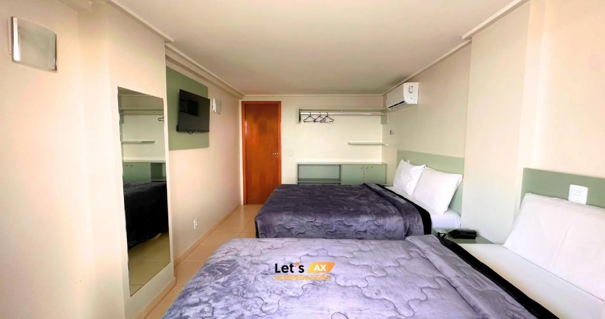 Bed in AX Blue Suítes