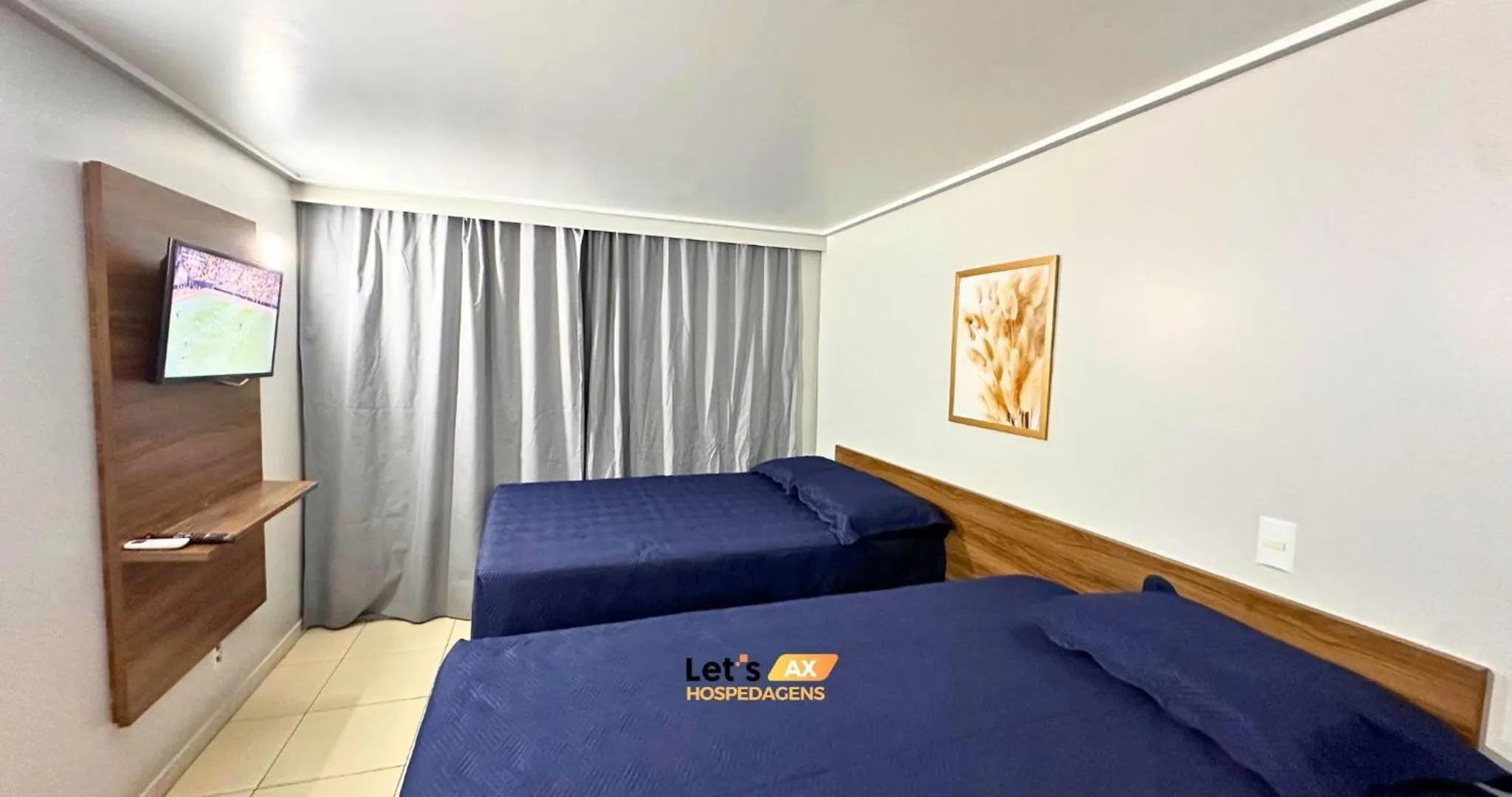 Seating area, Bed in AX Blue Suítes