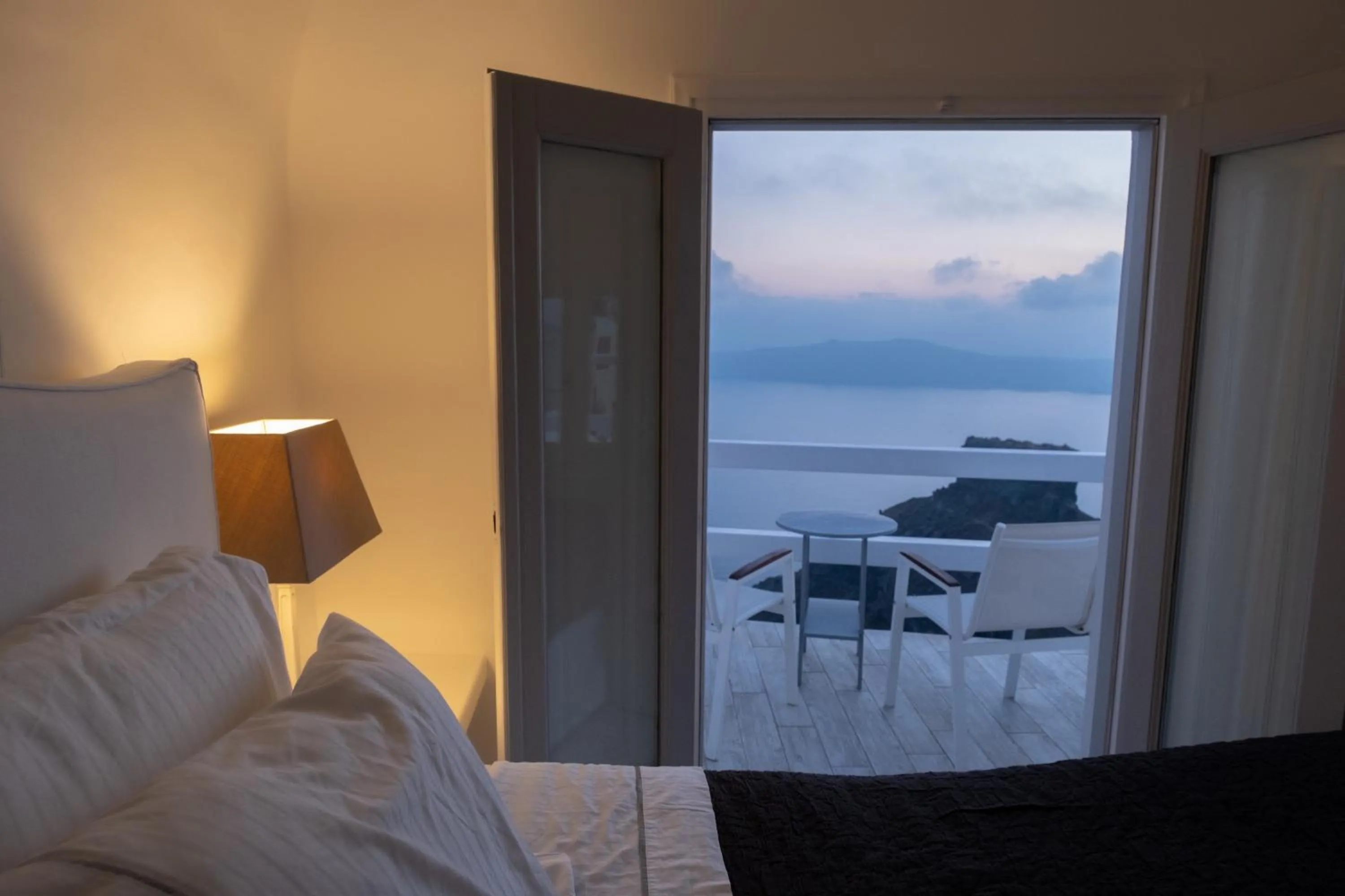 Bed in Anemos Cave Suites