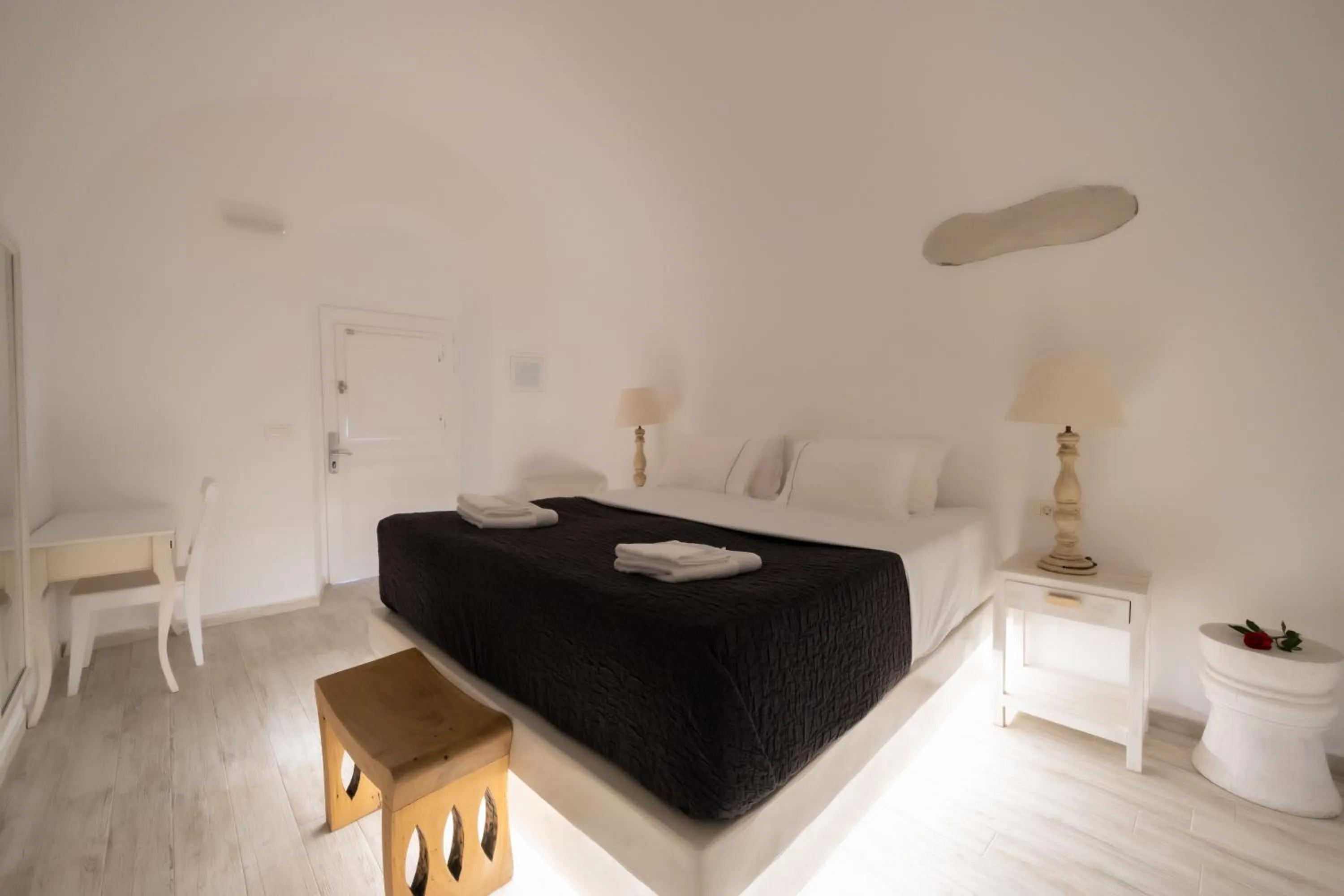 Bed in Anemos Cave Suites