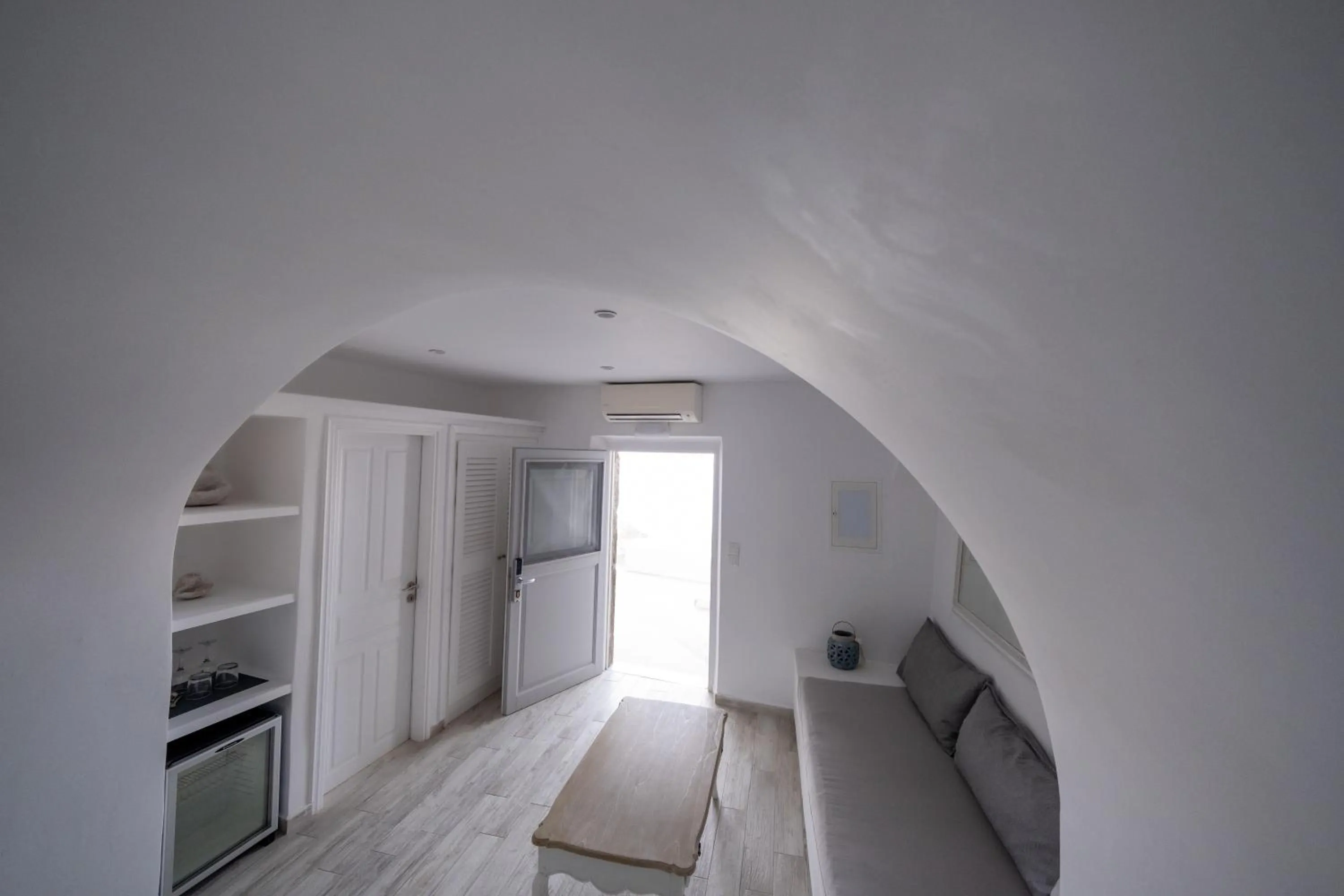 Bed in Anemos Cave Suites