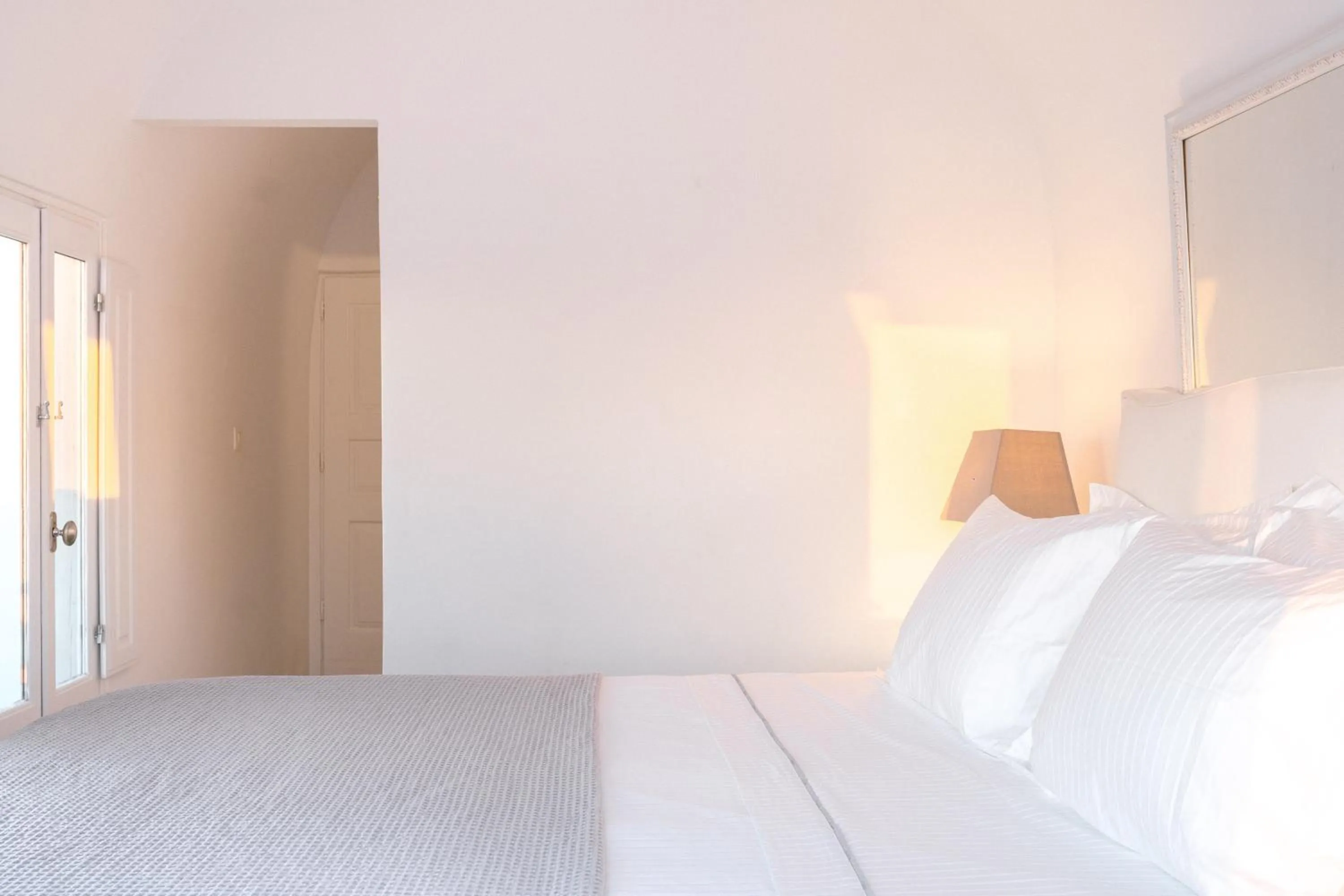 Bed in Anemos Cave Suites