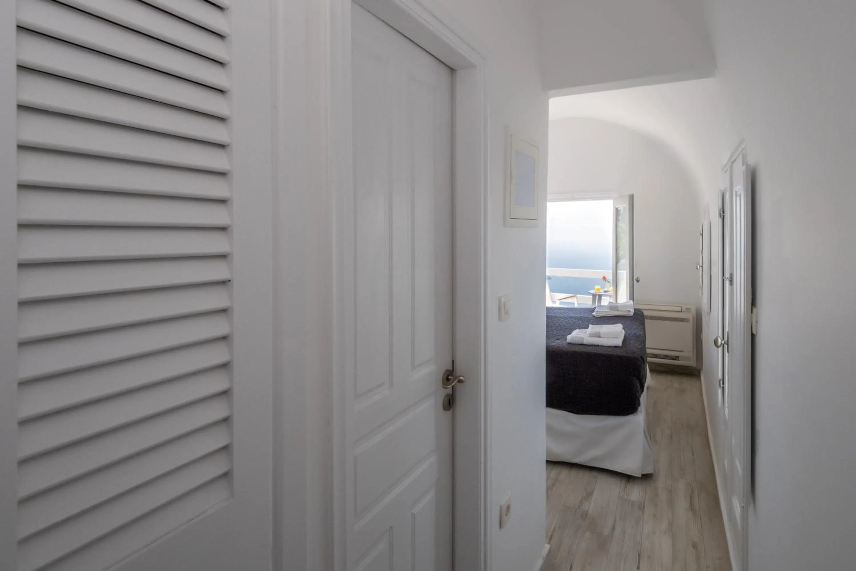 Bed in Anemos Cave Suites