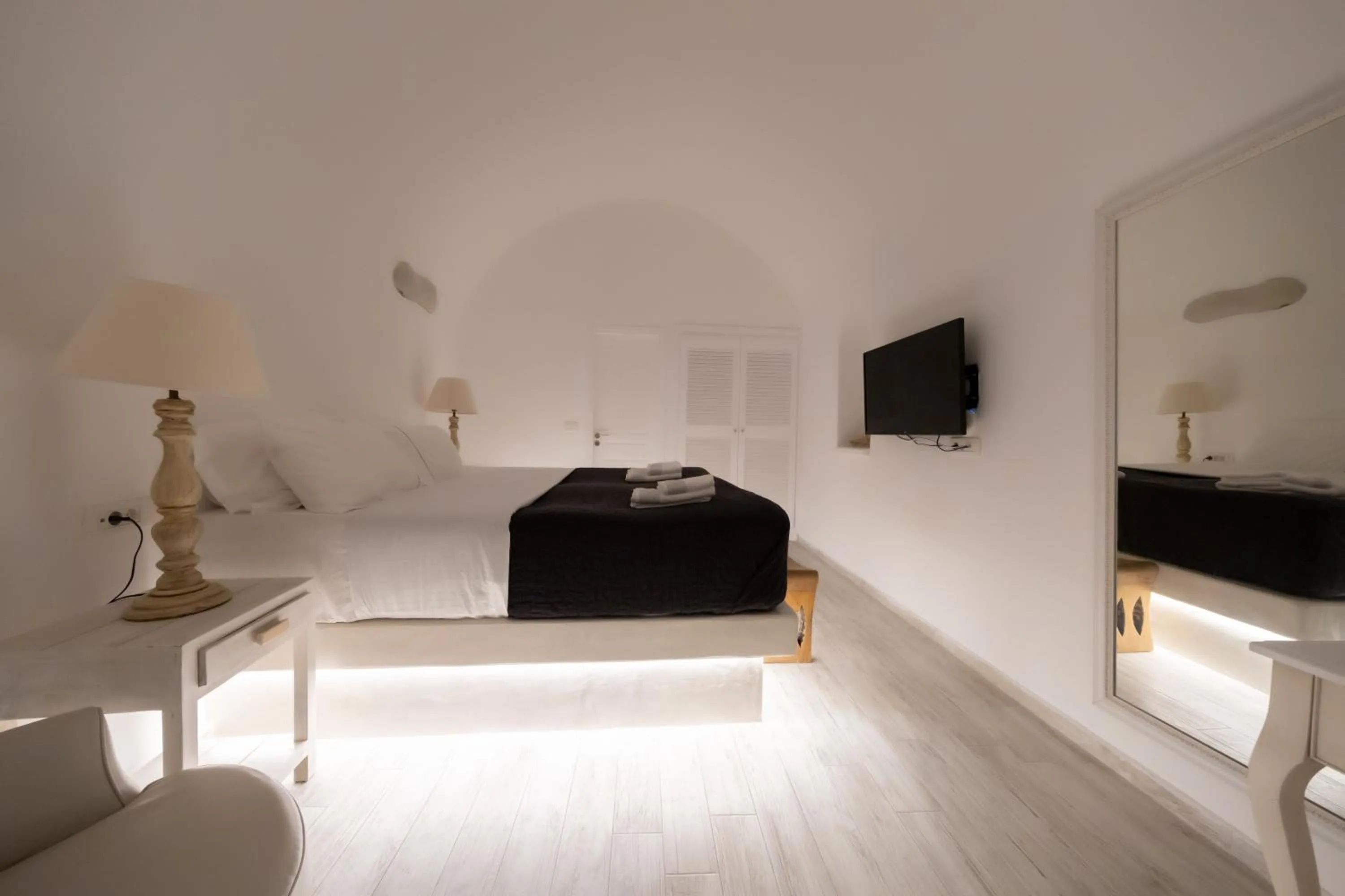 Bed in Anemos Cave Suites