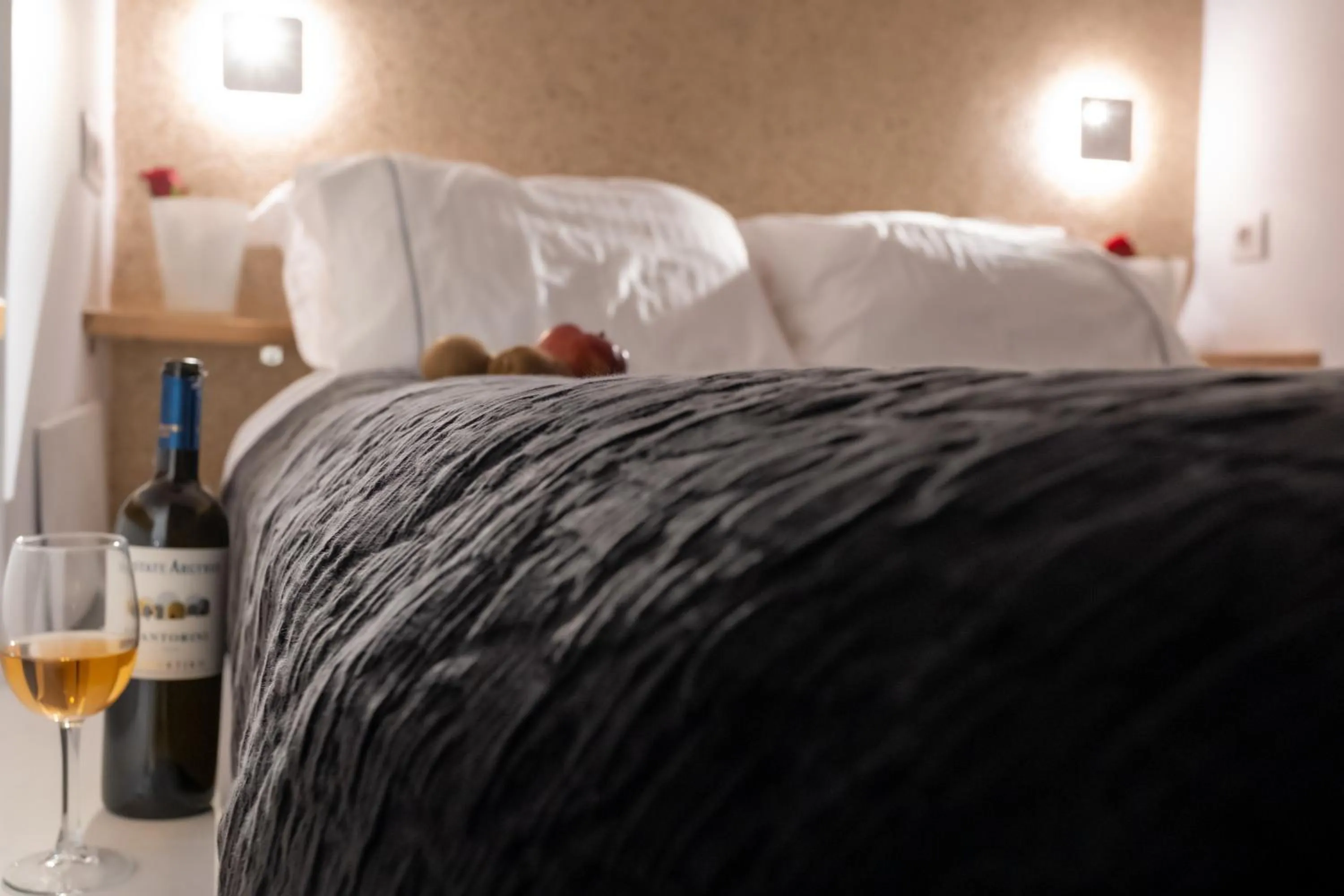 Bed in Anemos Cave Suites