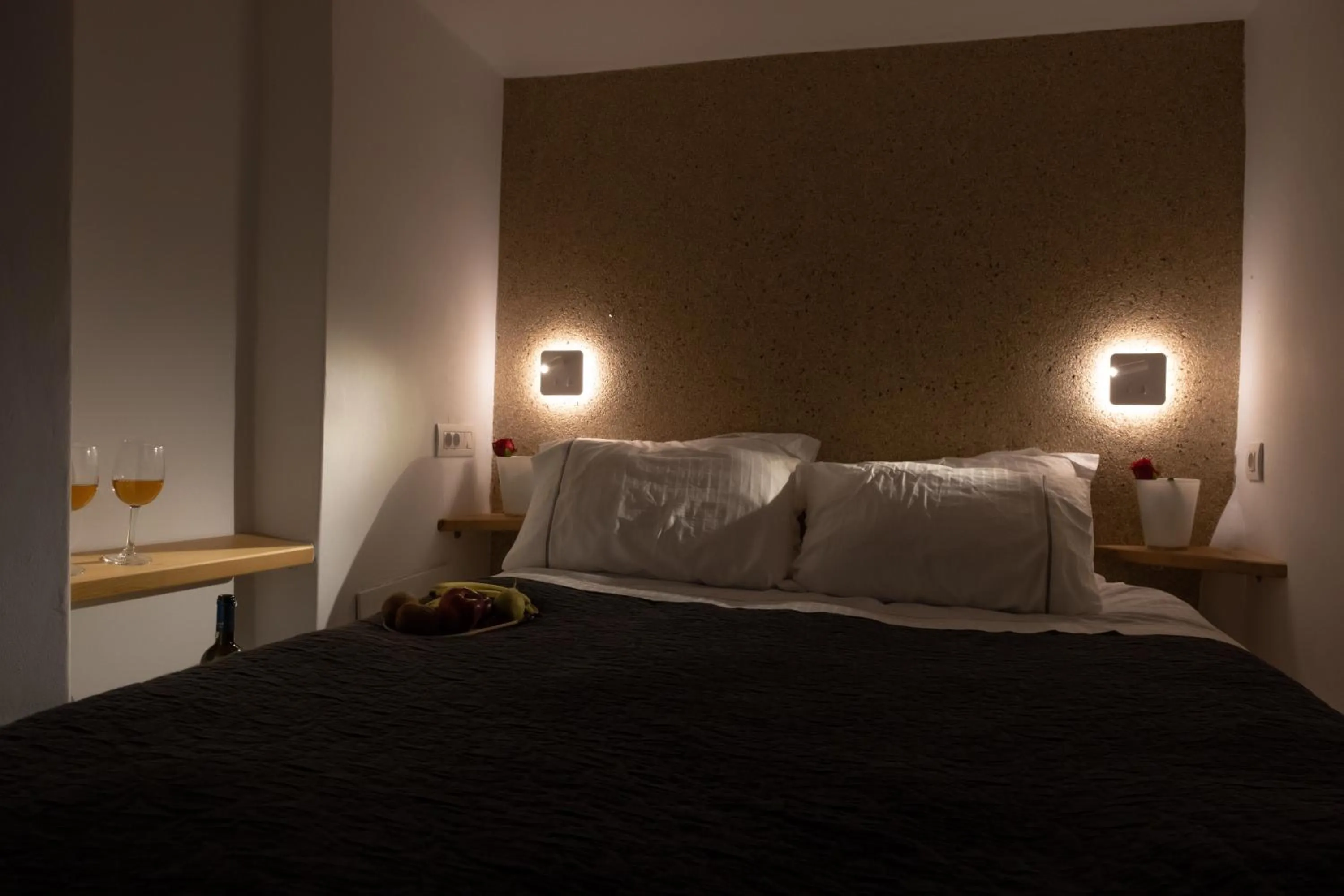 Bed in Anemos Cave Suites