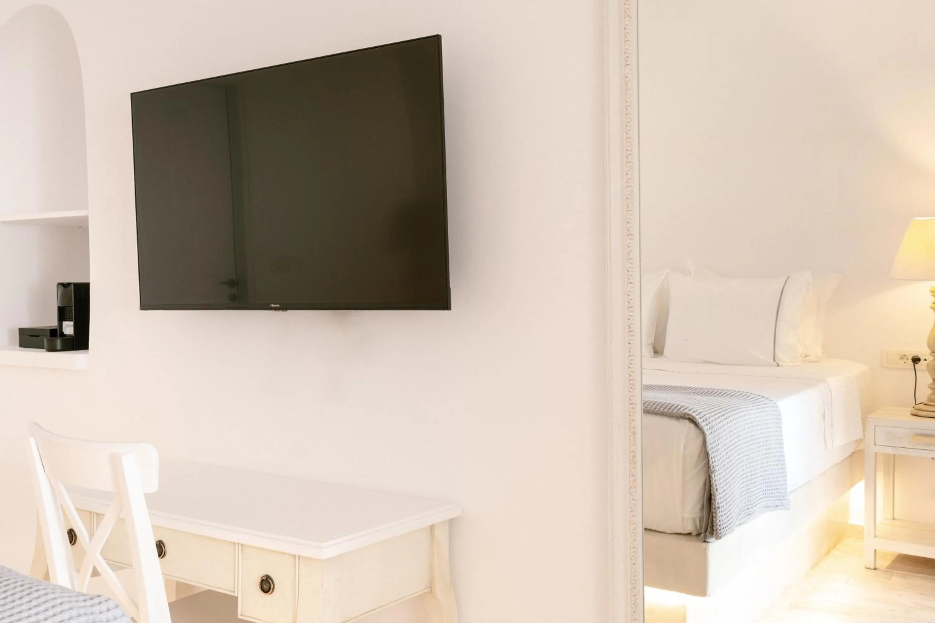 Bed in Anemos Cave Suites