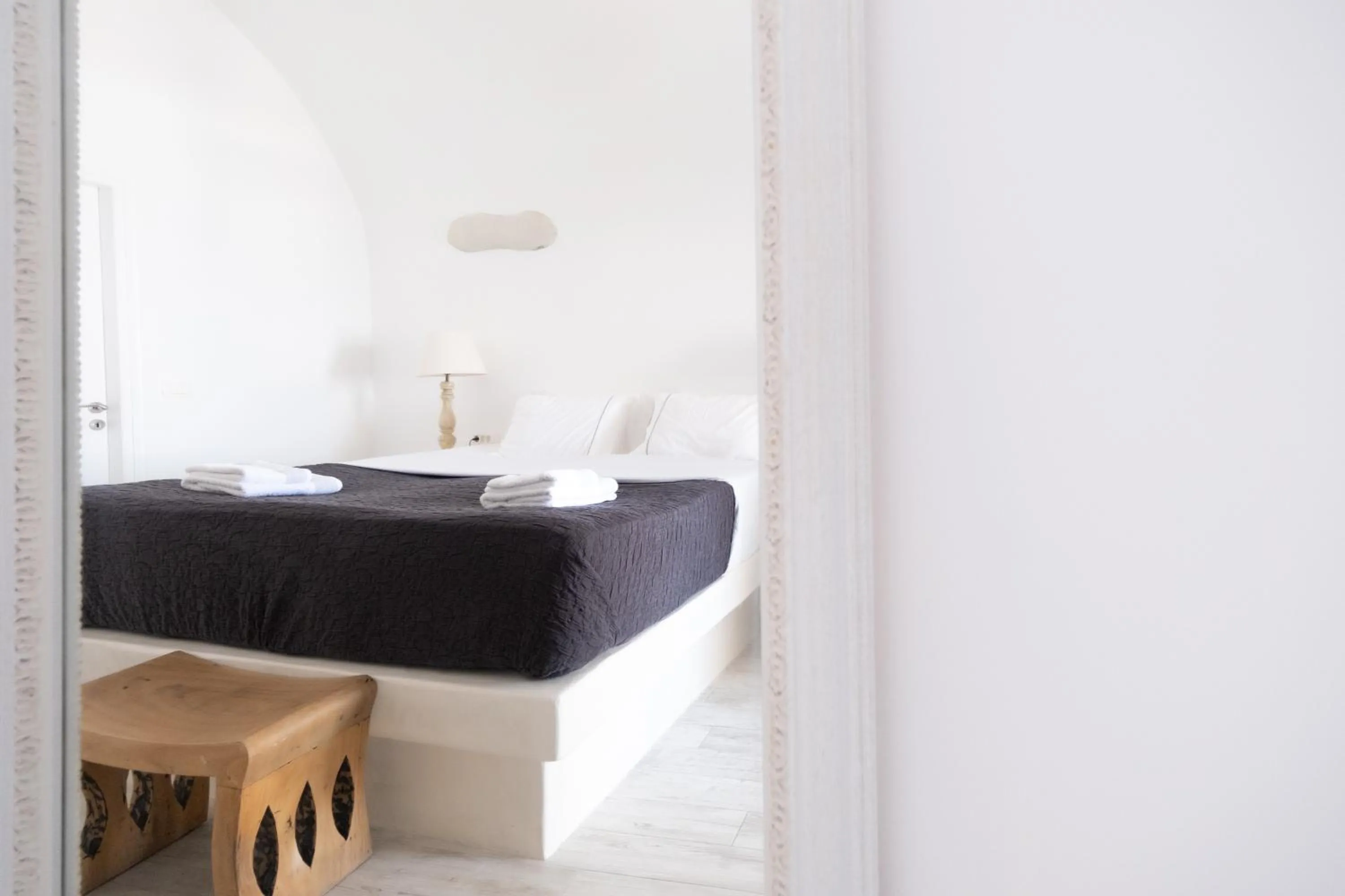 Bed in Anemos Cave Suites