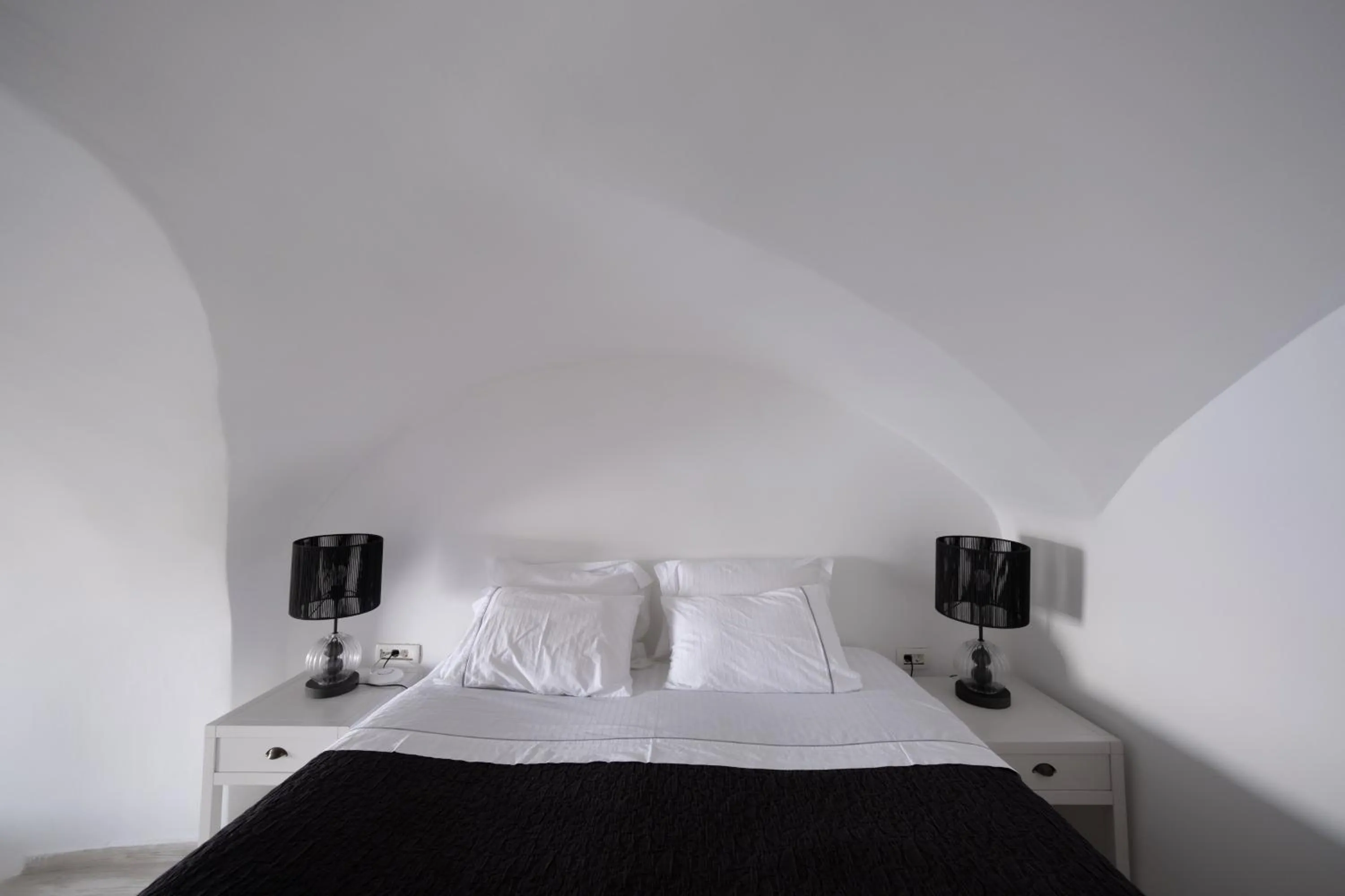 Bed in Anemos Cave Suites