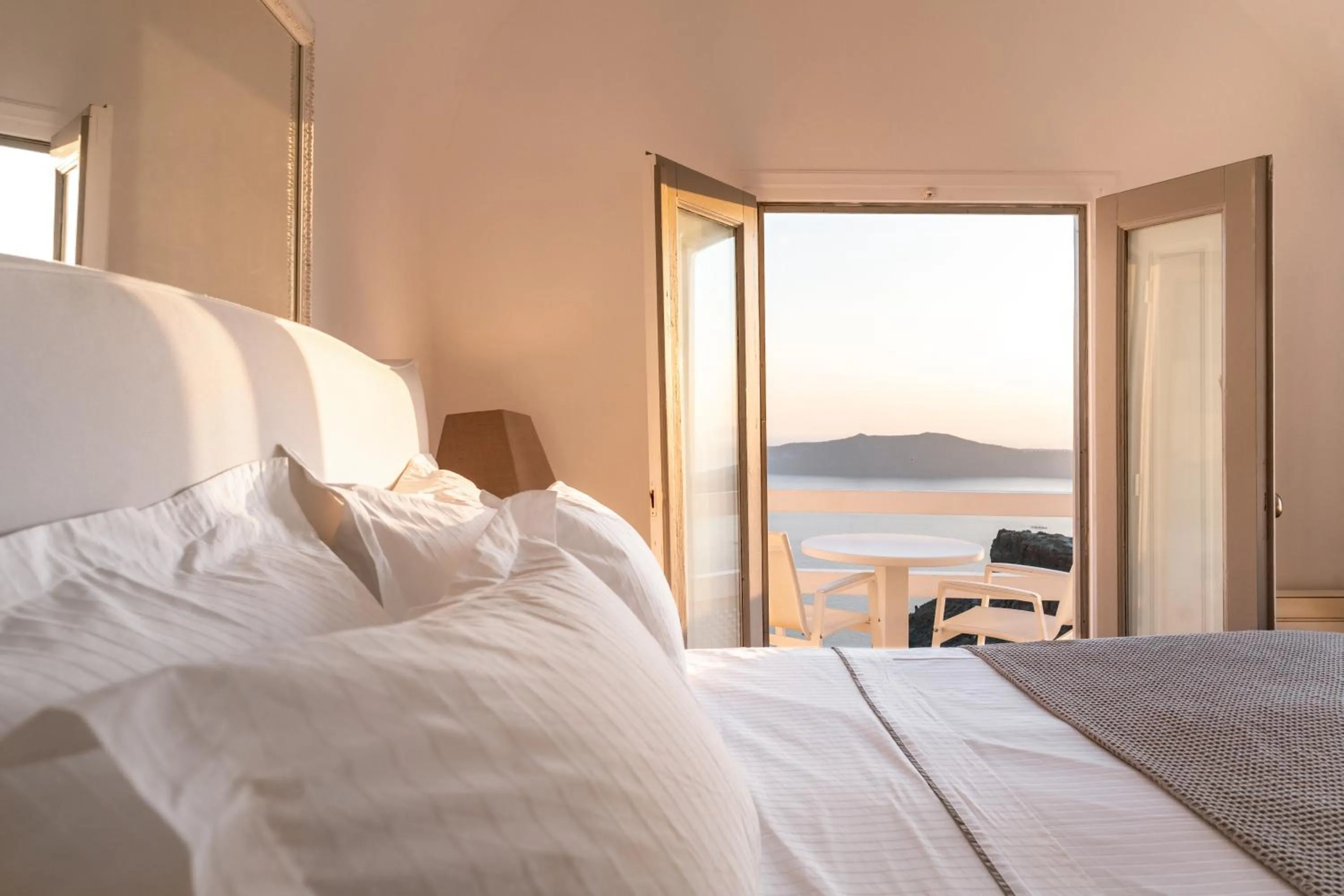 Bed in Anemos Cave Suites