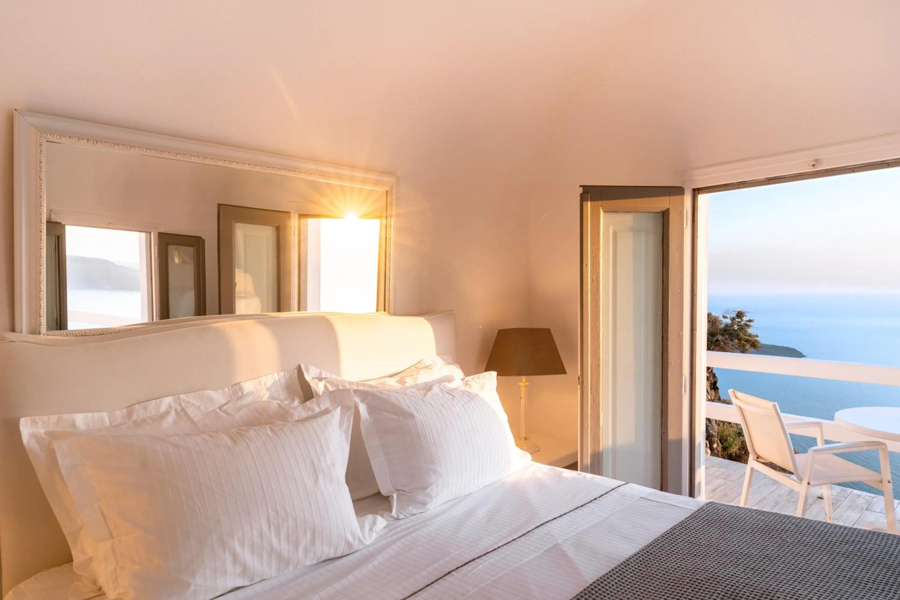 Bed in Anemos Cave Suites