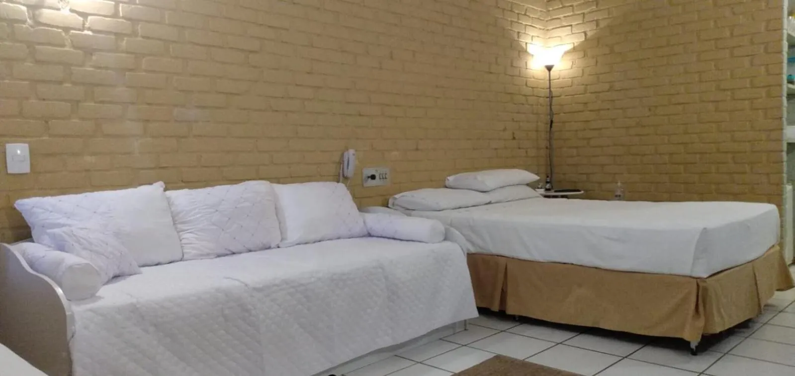 Bed in Angra dos Reis Flat Suíte no Portogalo