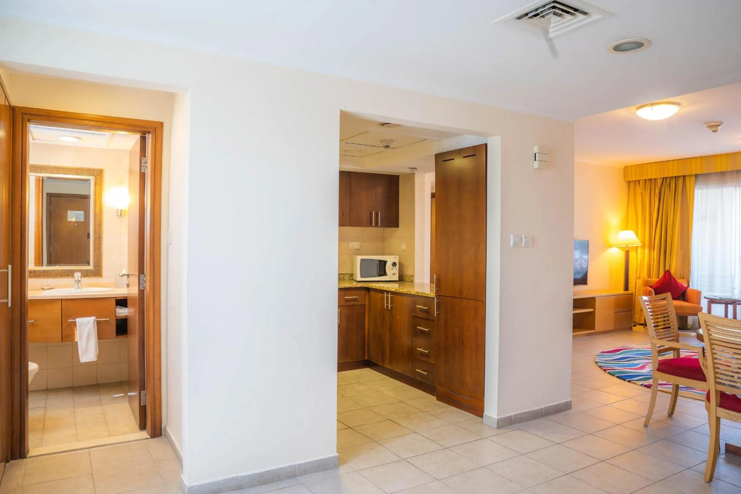 Living room, Kitchen/Kitchenette in Copthorne Lakeview Executive Apartments Dubai, Green Community