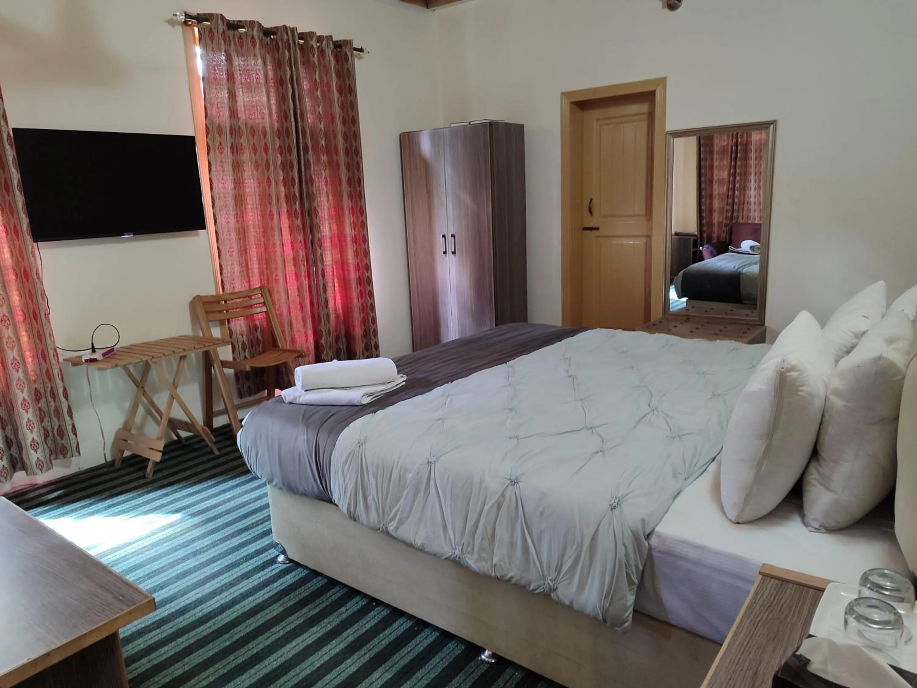 Bed in Grapes Garden Resort Hunza