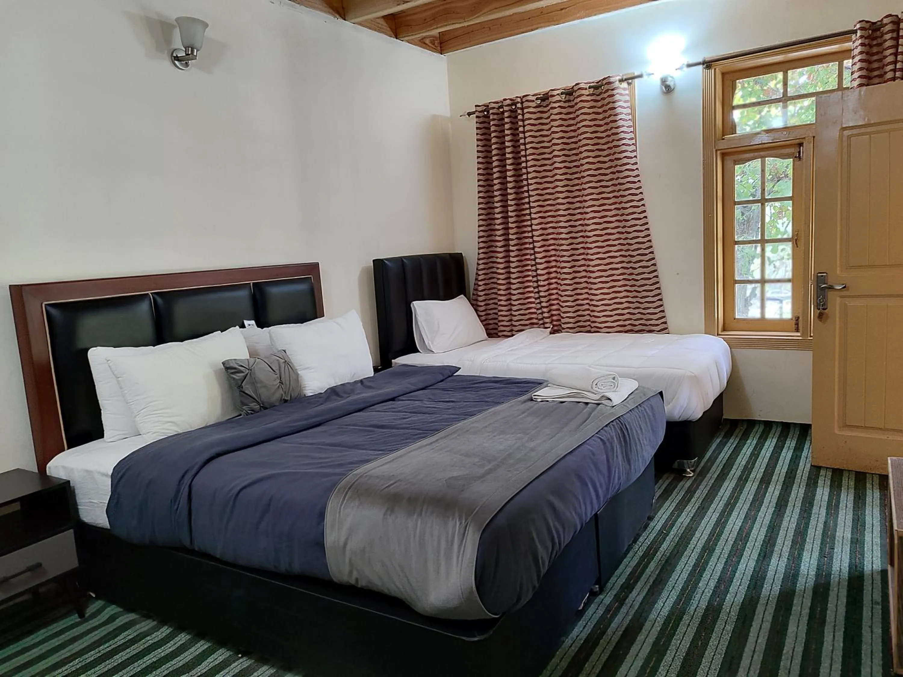 Bed in Grapes Garden Resort Hunza
