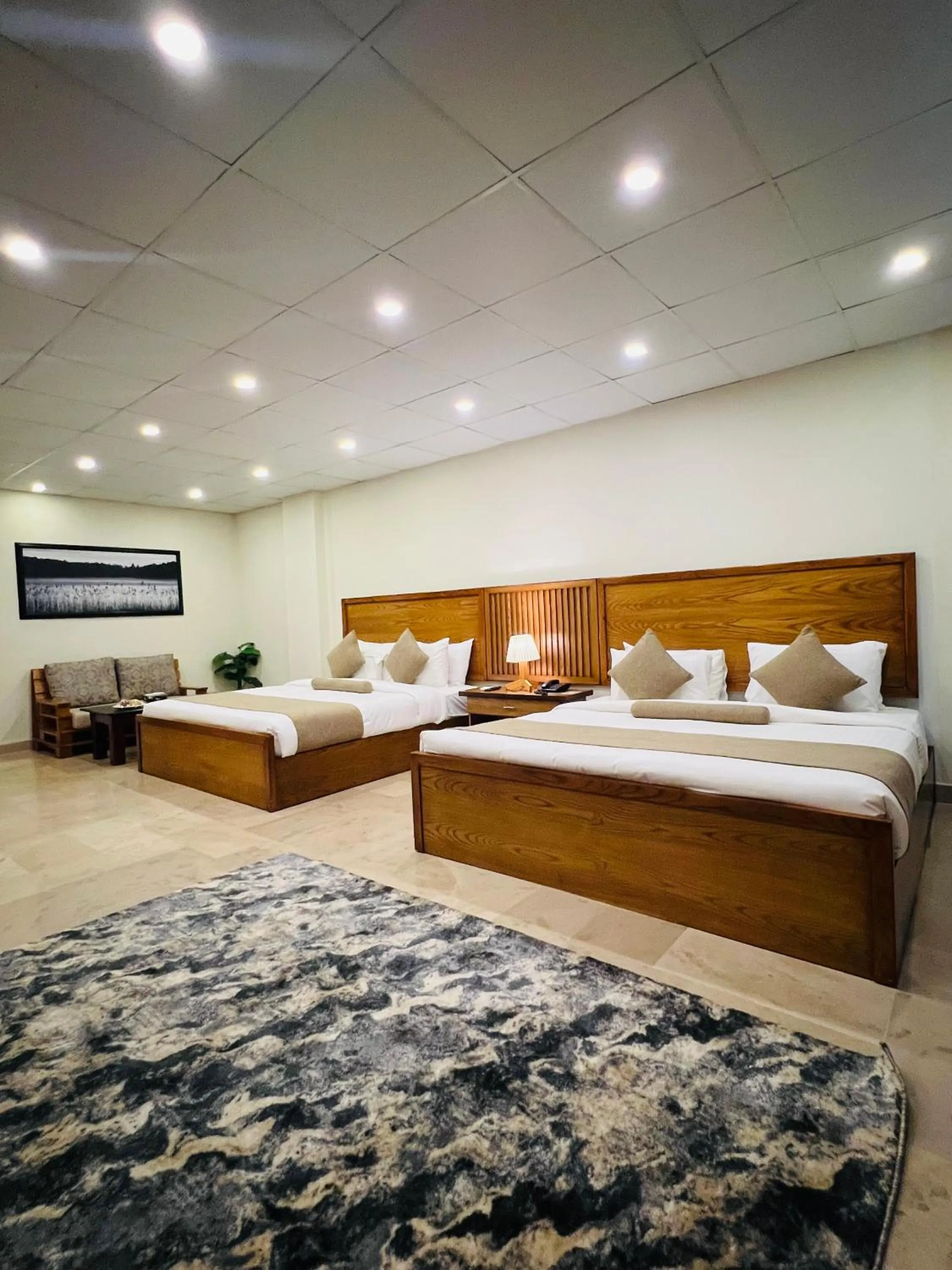 Bed in Grand Islamabad Hotel