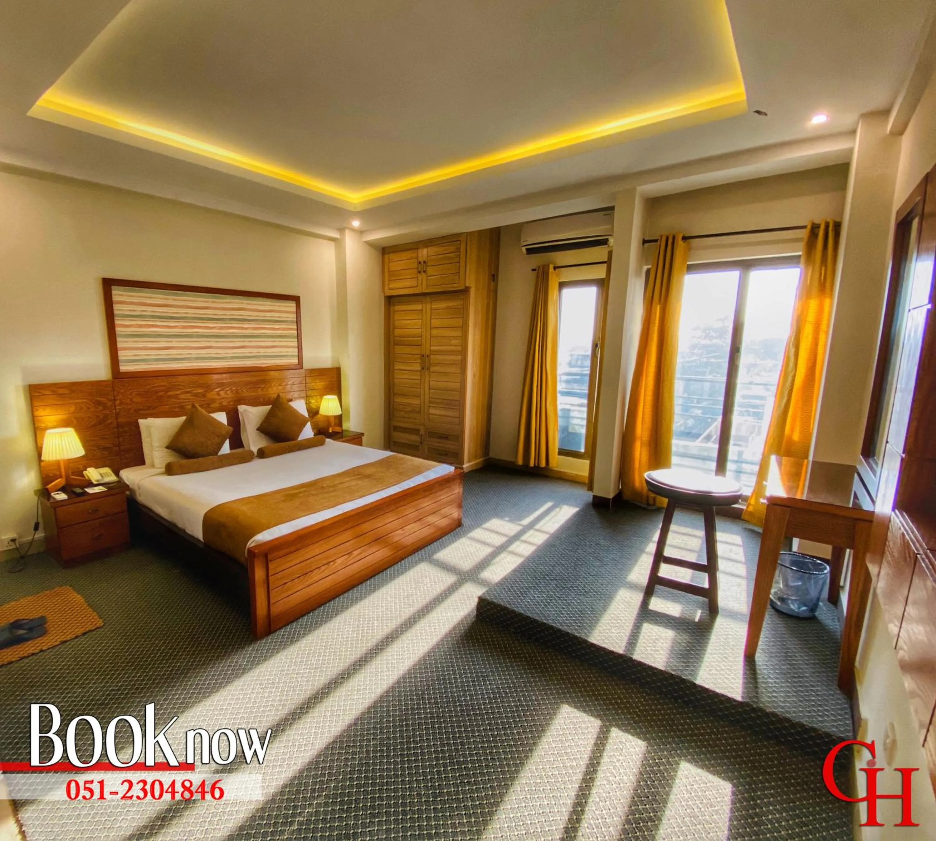 Bed in Grand Islamabad Hotel