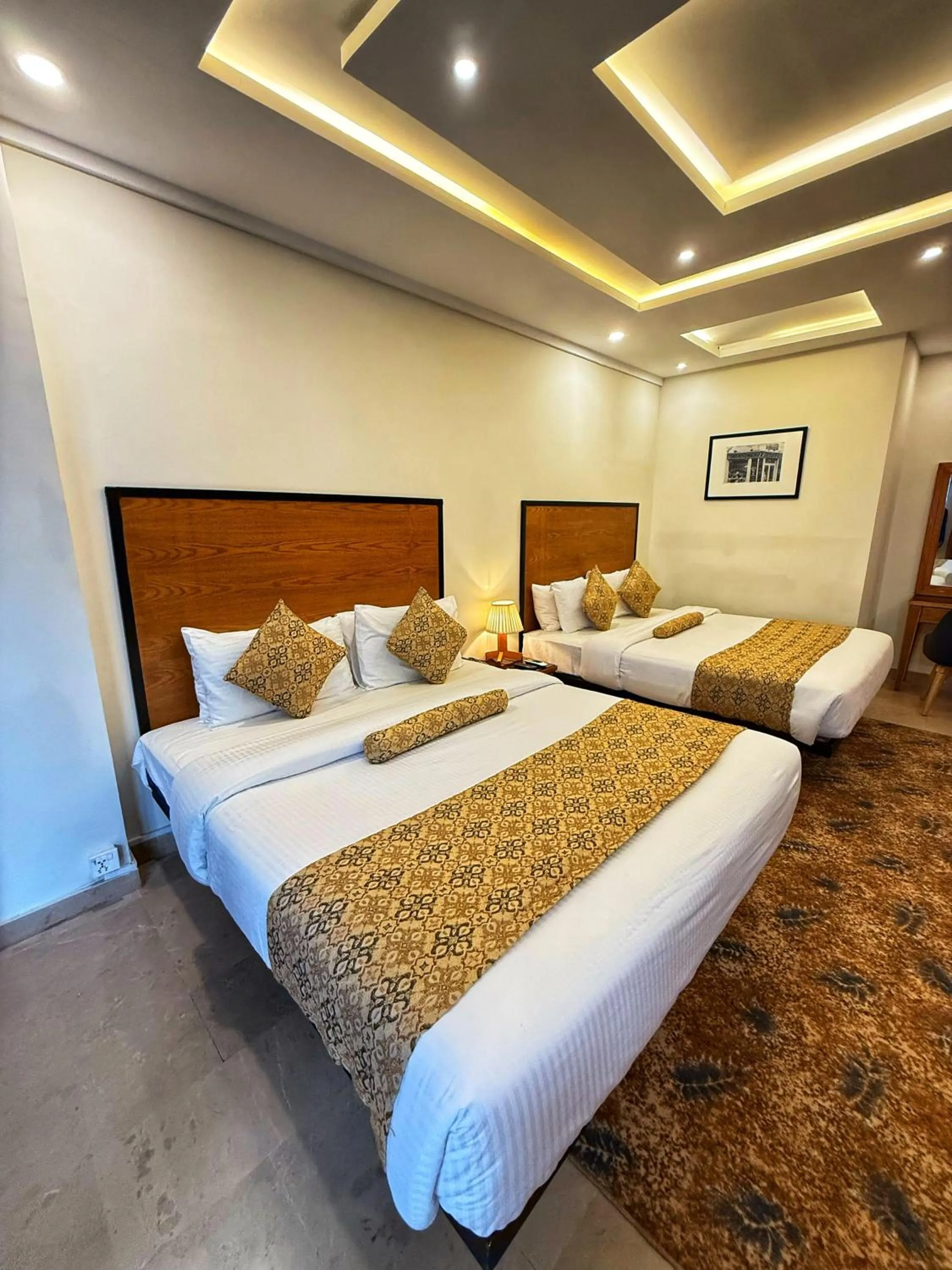 Bed in Grand Islamabad Hotel