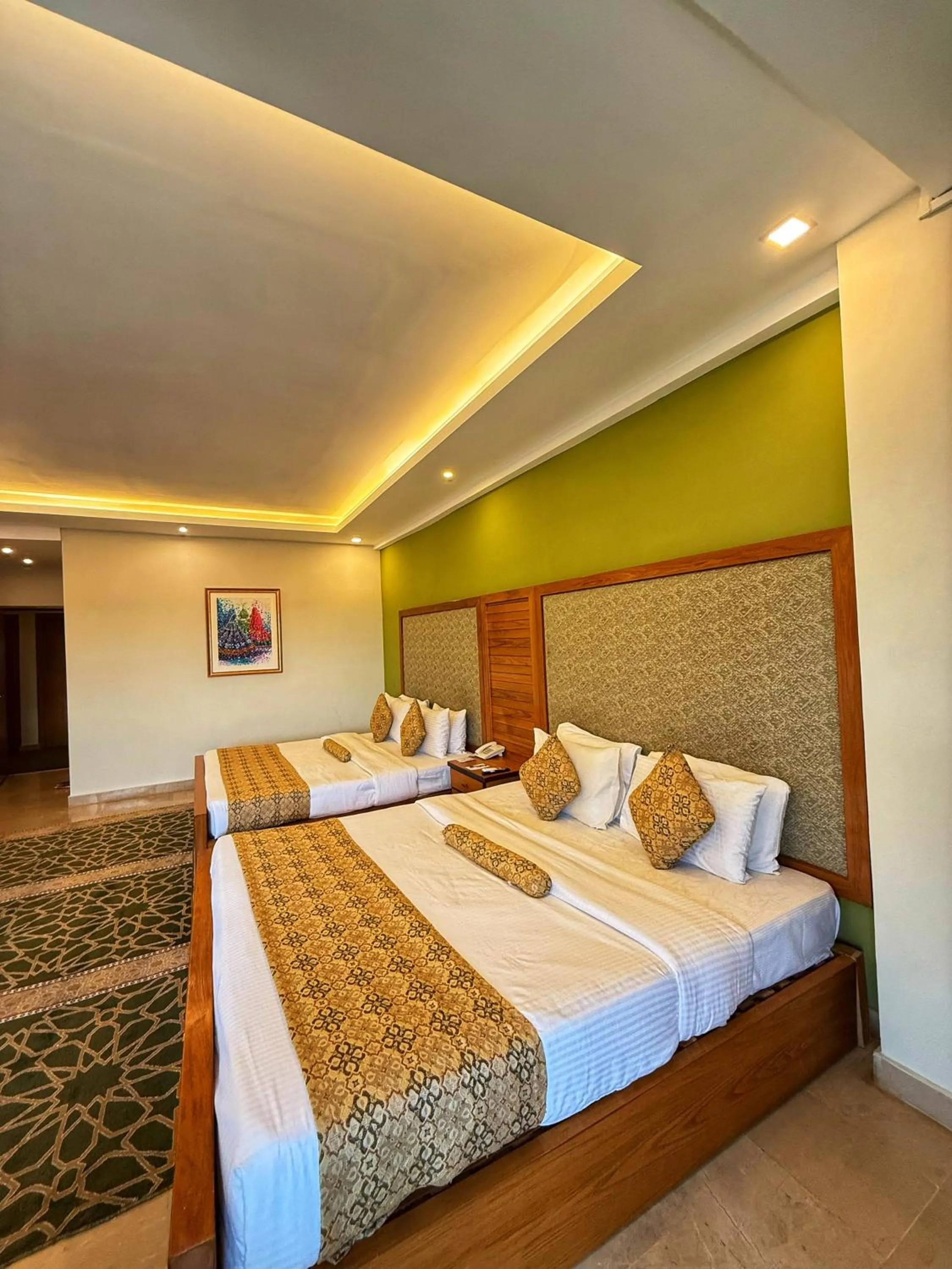 Bed in Grand Islamabad Hotel