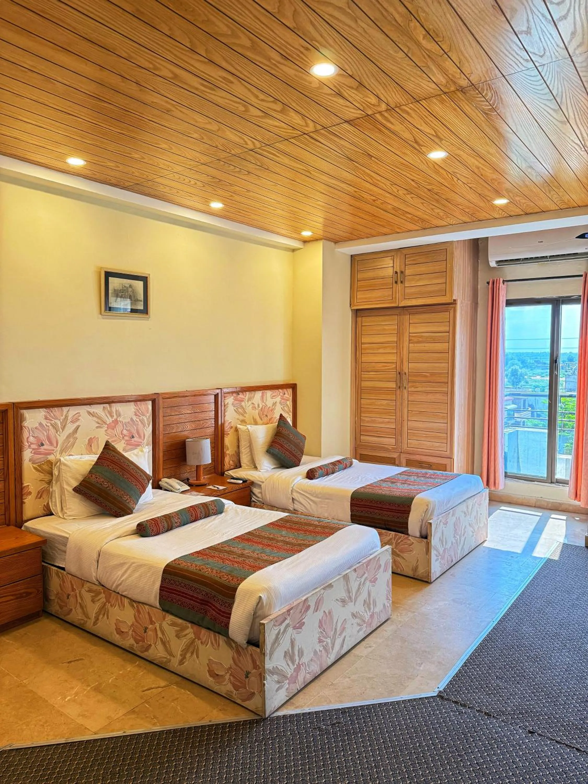 Bed in Grand Islamabad Hotel