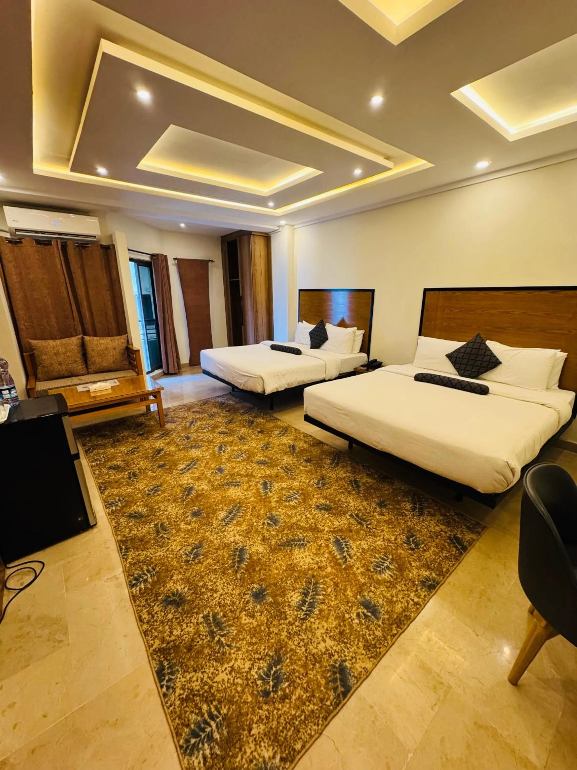 Bed in Grand Islamabad Hotel