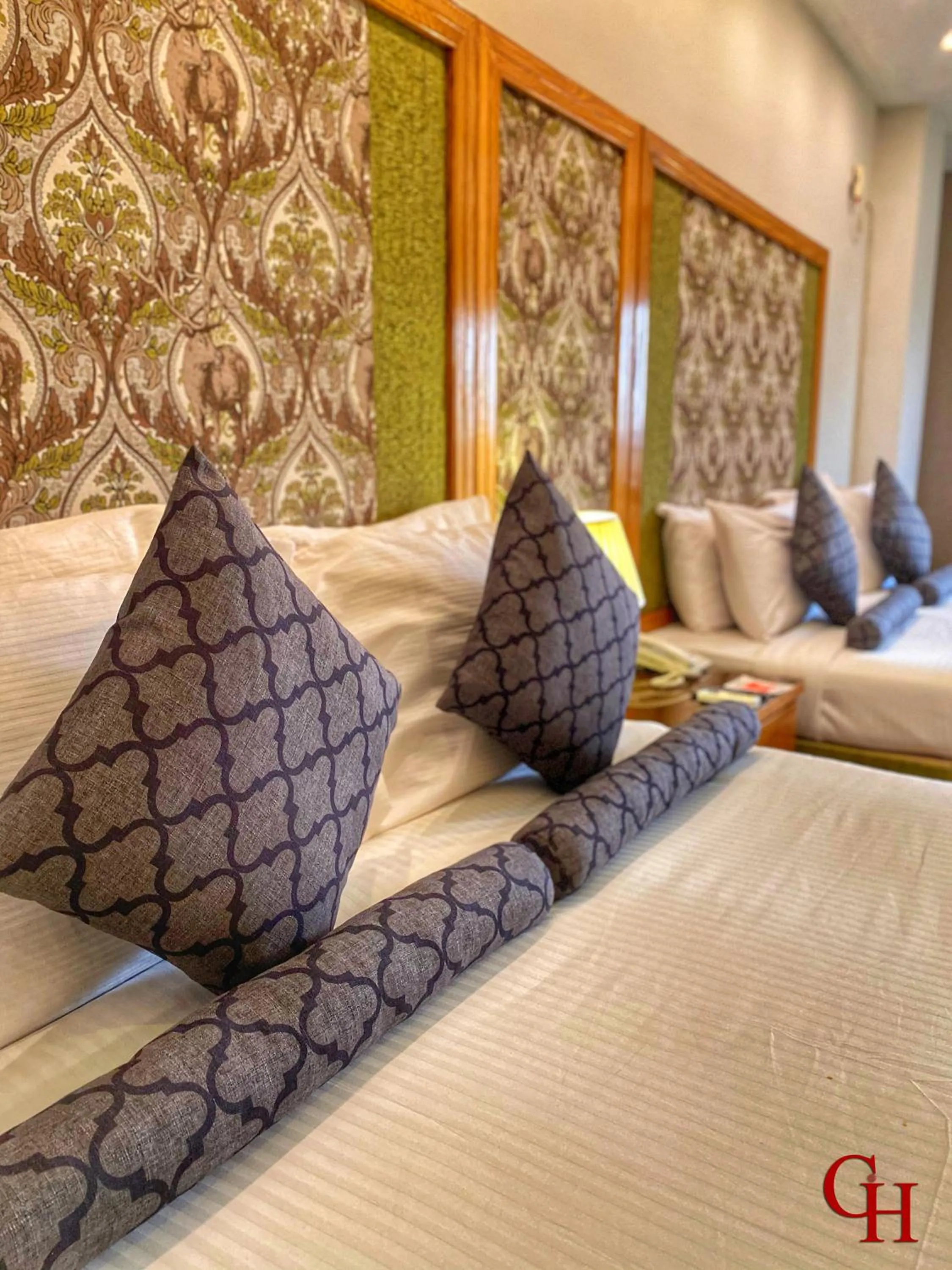 Bed in Grand Islamabad Hotel