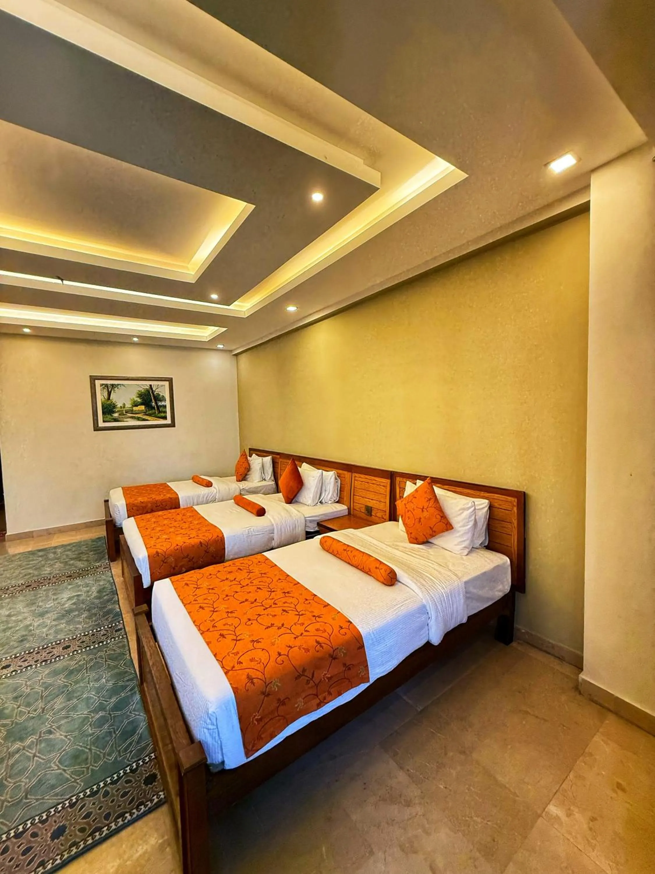 Bed in Grand Islamabad Hotel