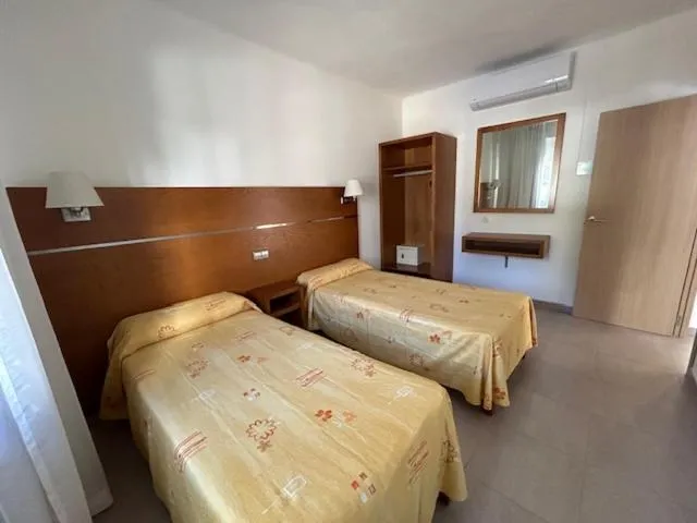 Bed in APARTAMENTOS DON JUAN