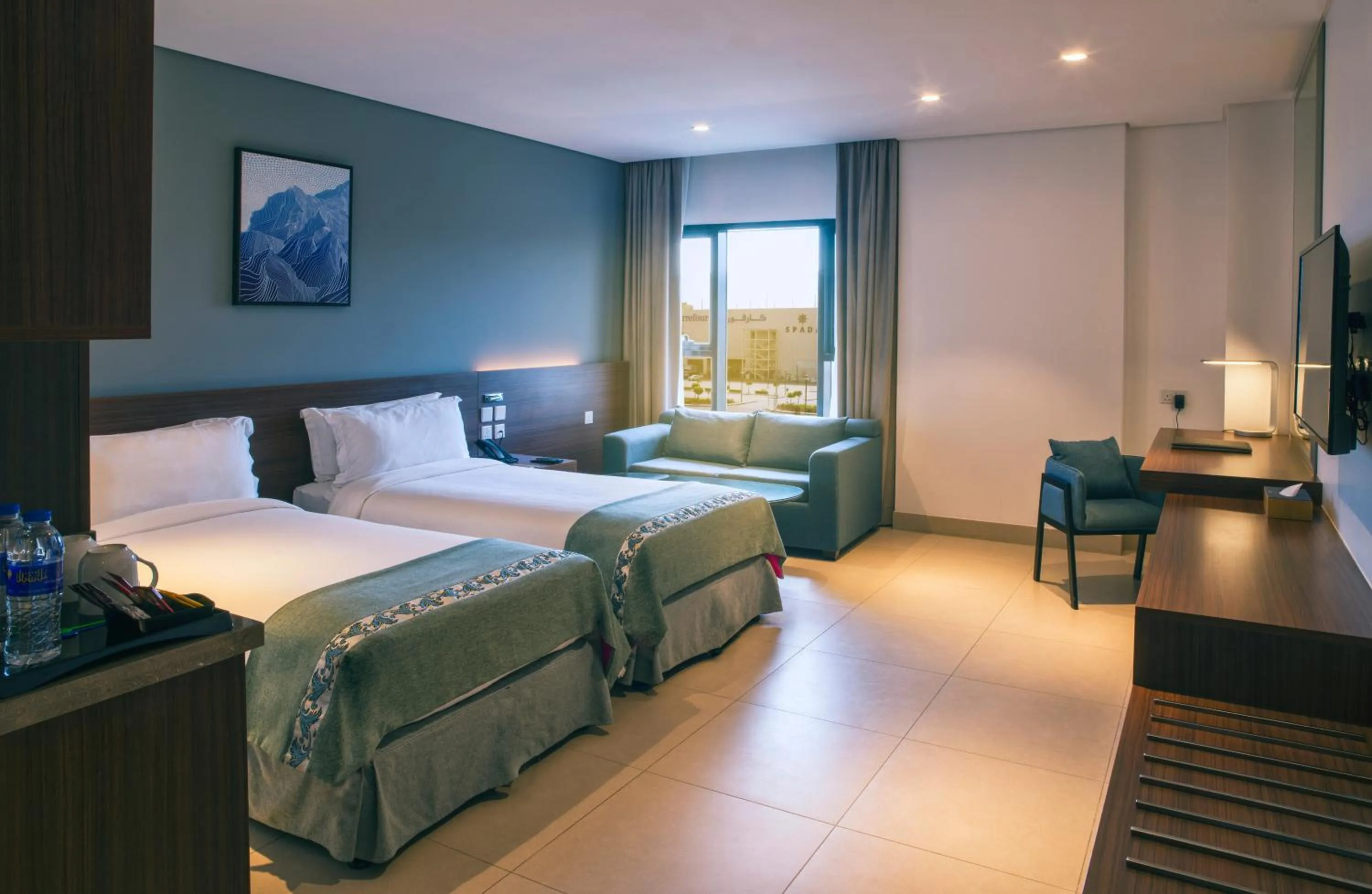 Living room, Bed in Boulevard Oman Hotel