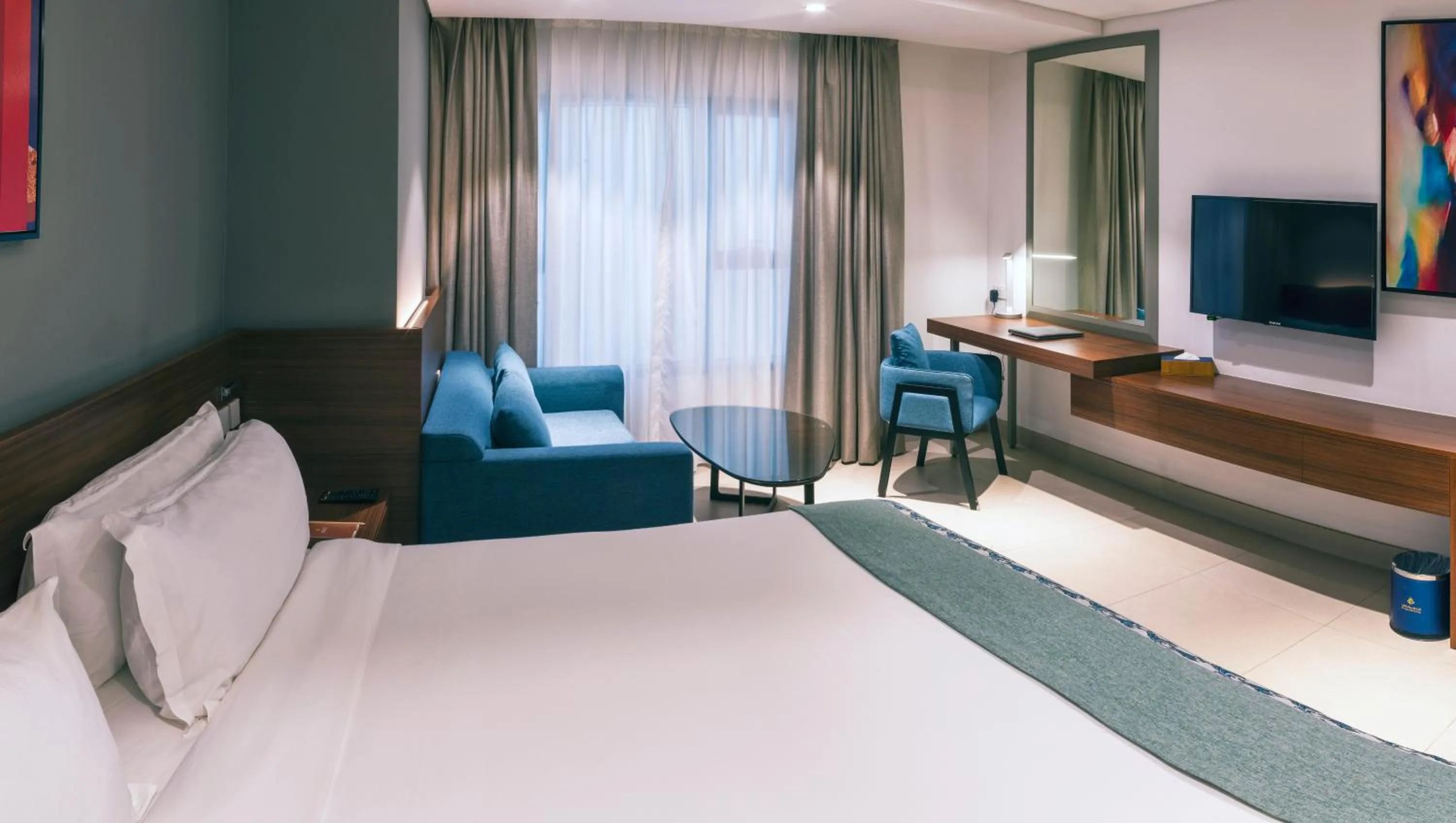 Seating area, Bed in Boulevard Oman Hotel