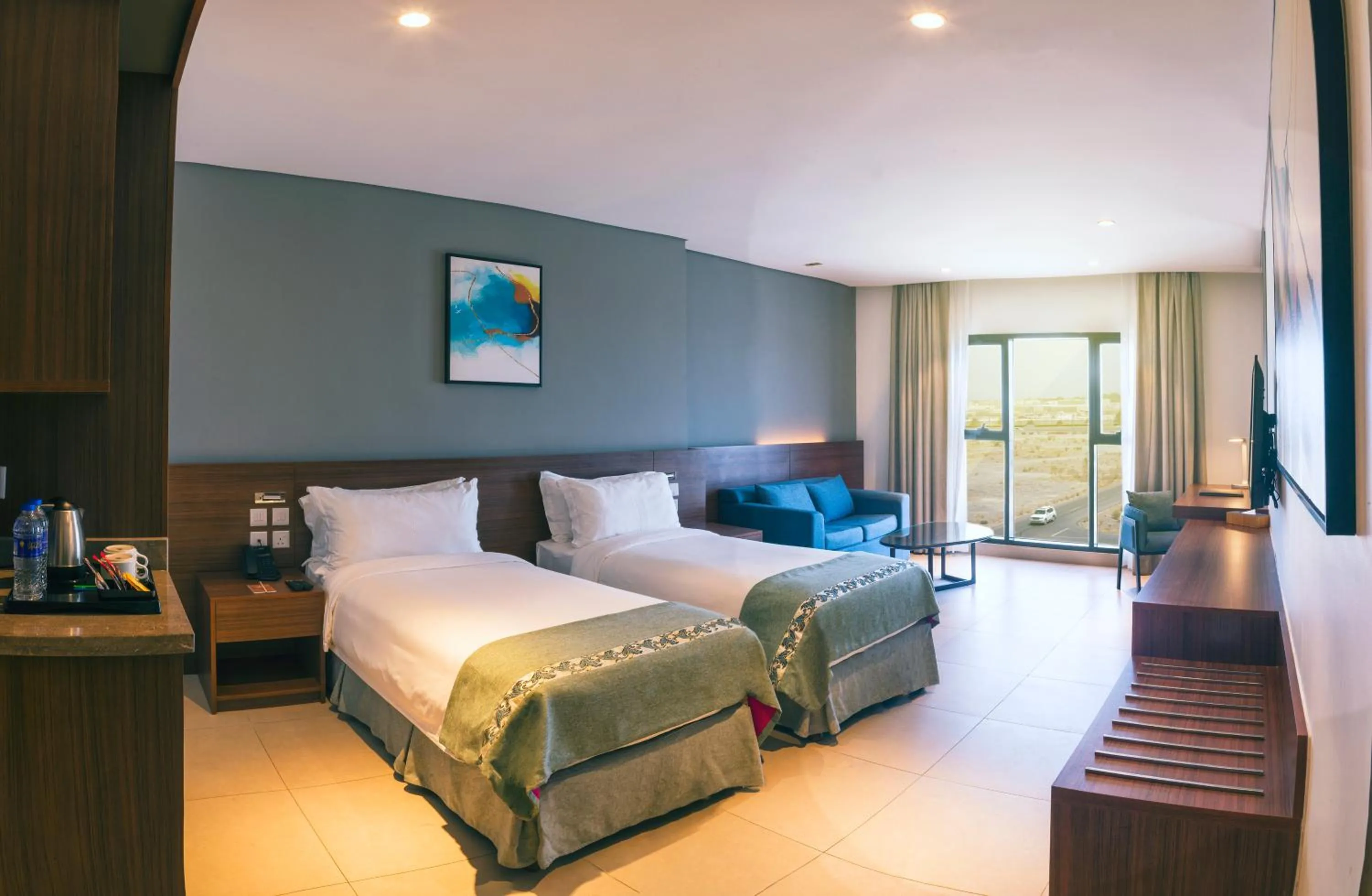 Living room, Bed in Boulevard Oman Hotel