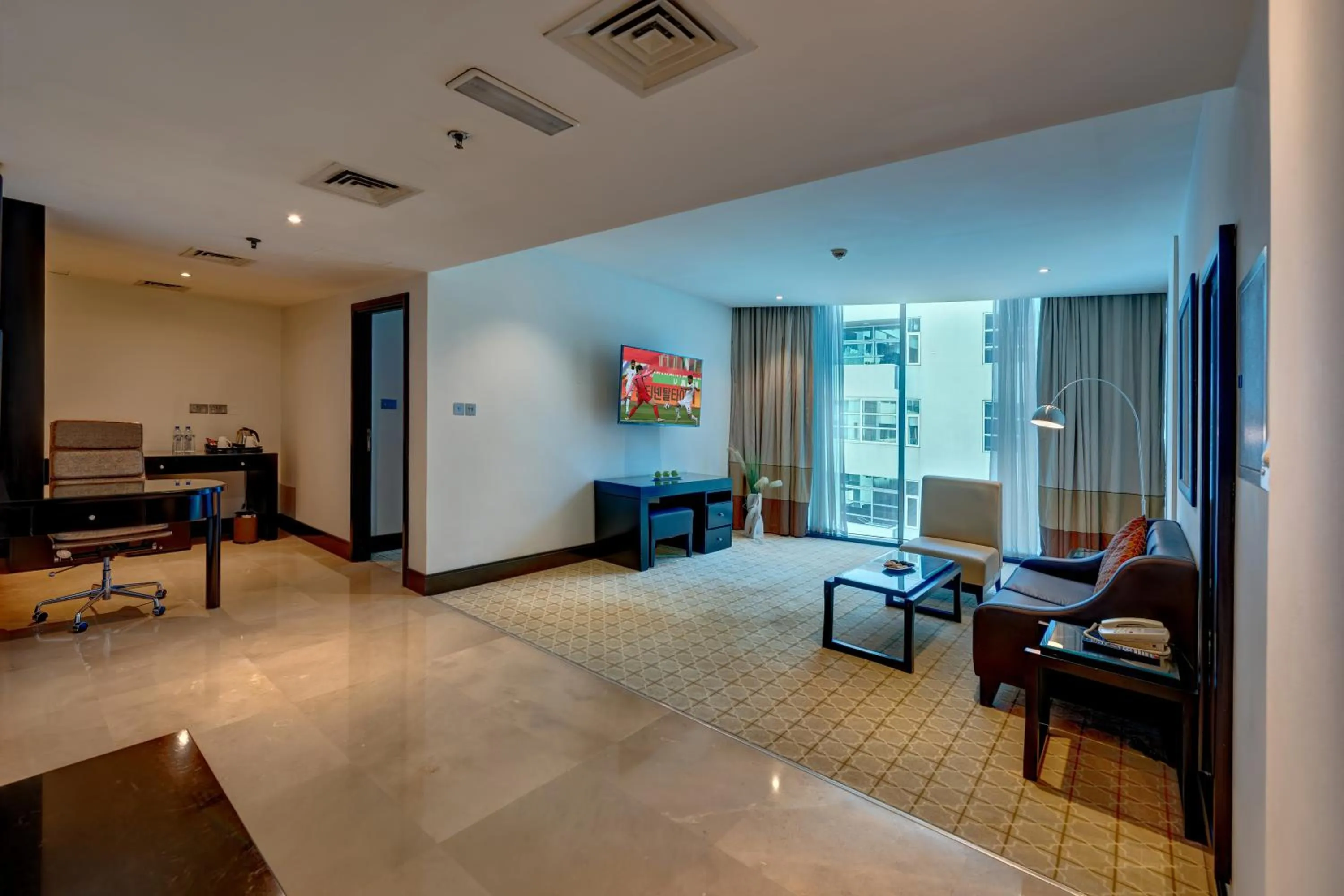 Living room in Holiday Inn Dubai Al Barsha by IHG