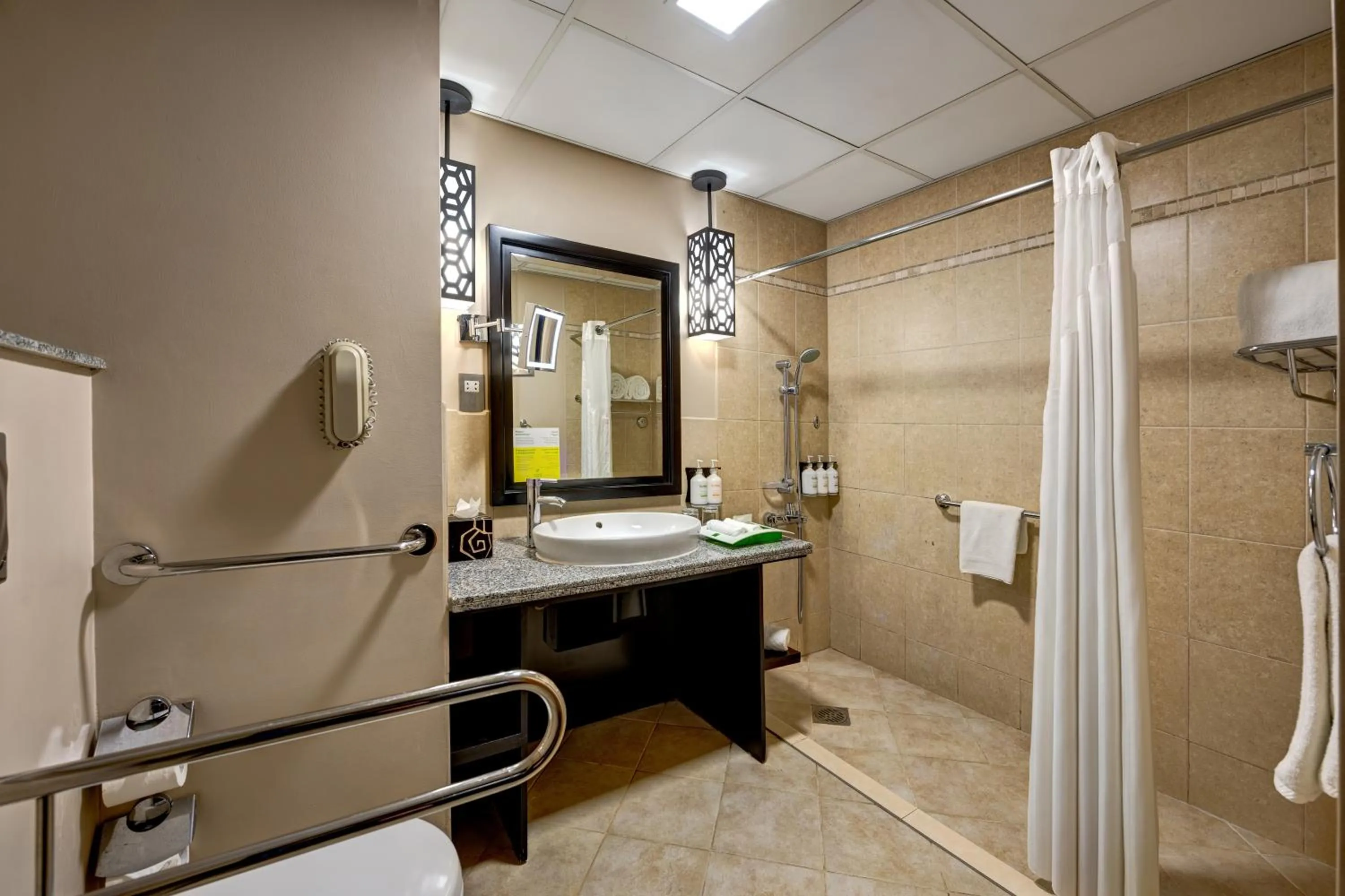 Bathroom in Holiday Inn Dubai Al Barsha by IHG