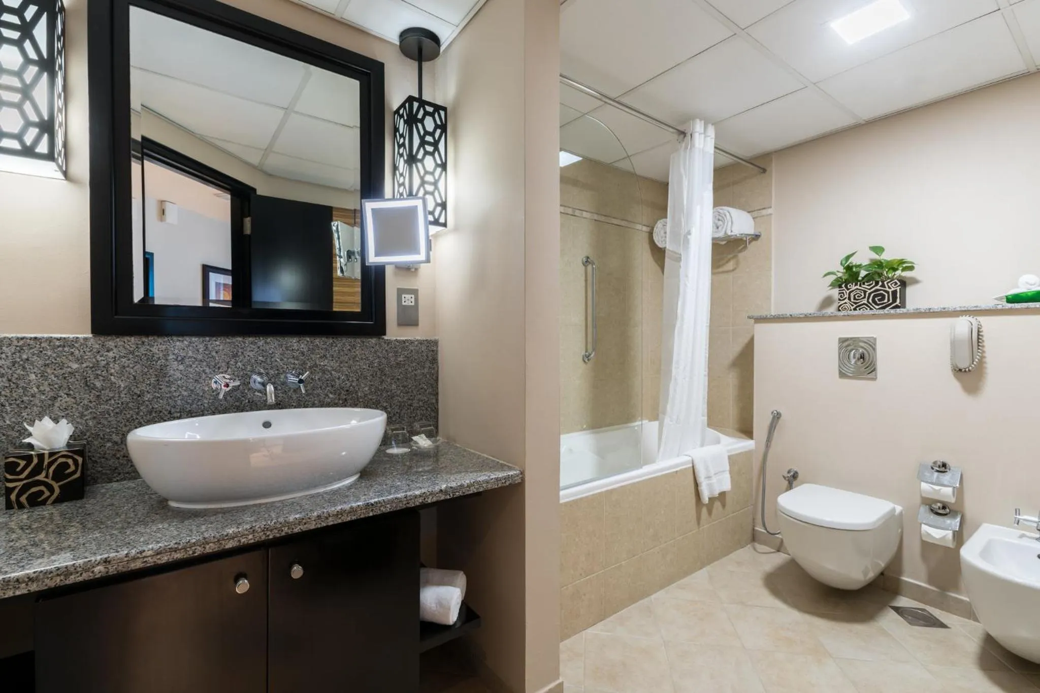 Bathroom in Holiday Inn Dubai Al Barsha by IHG