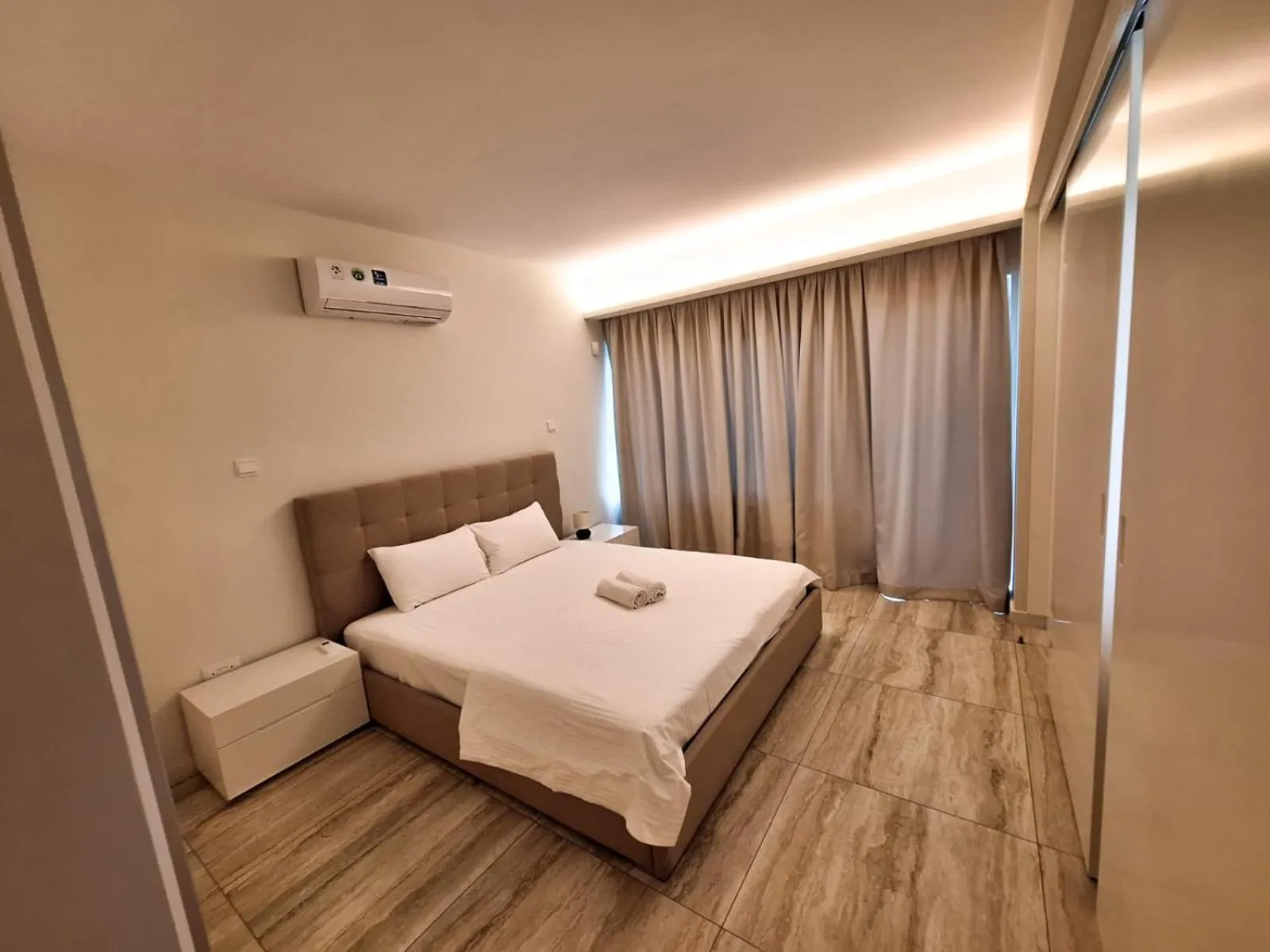 Bed in Emerald Suites