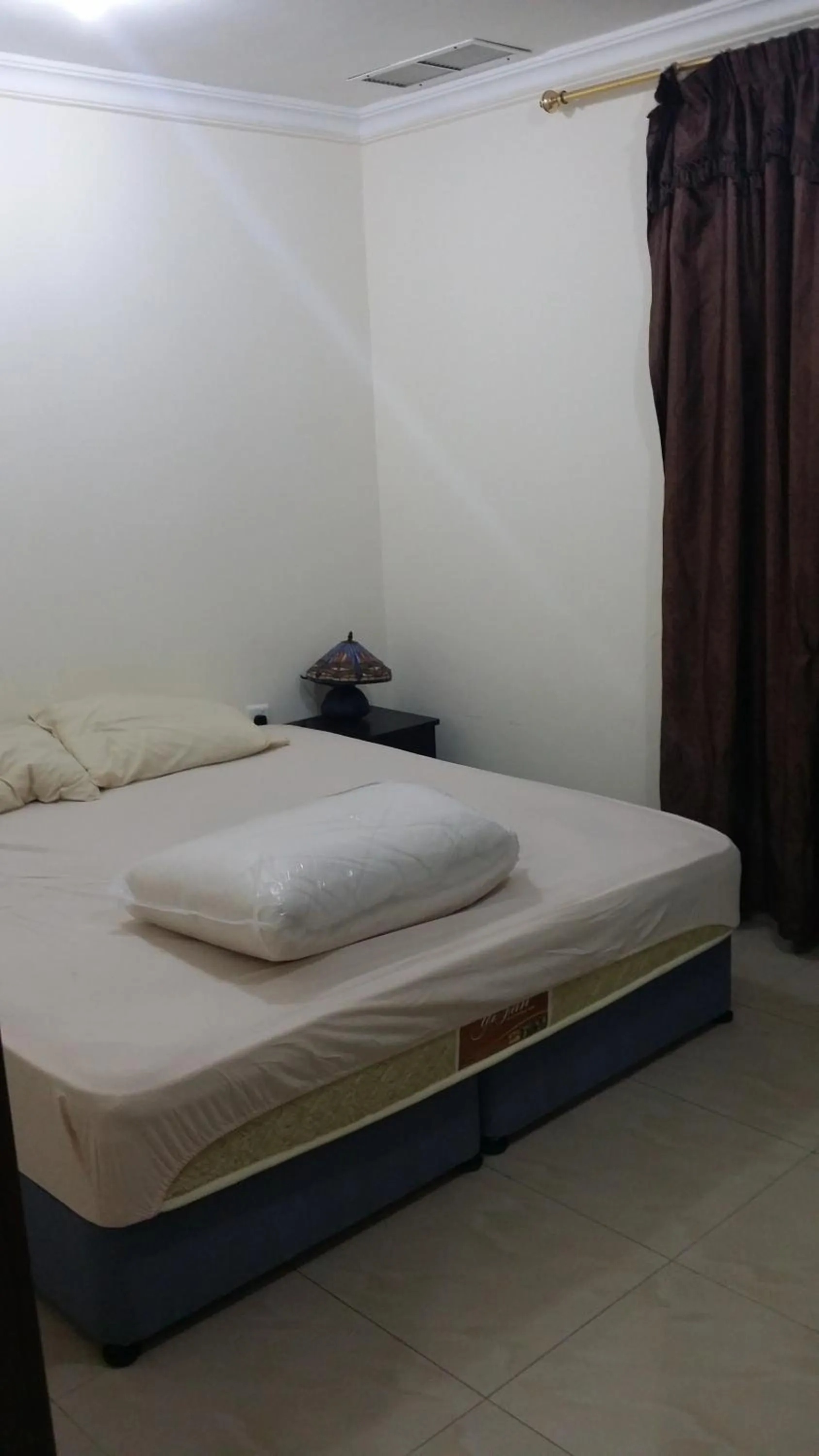 Bed in Red Tower Furnished Apartments