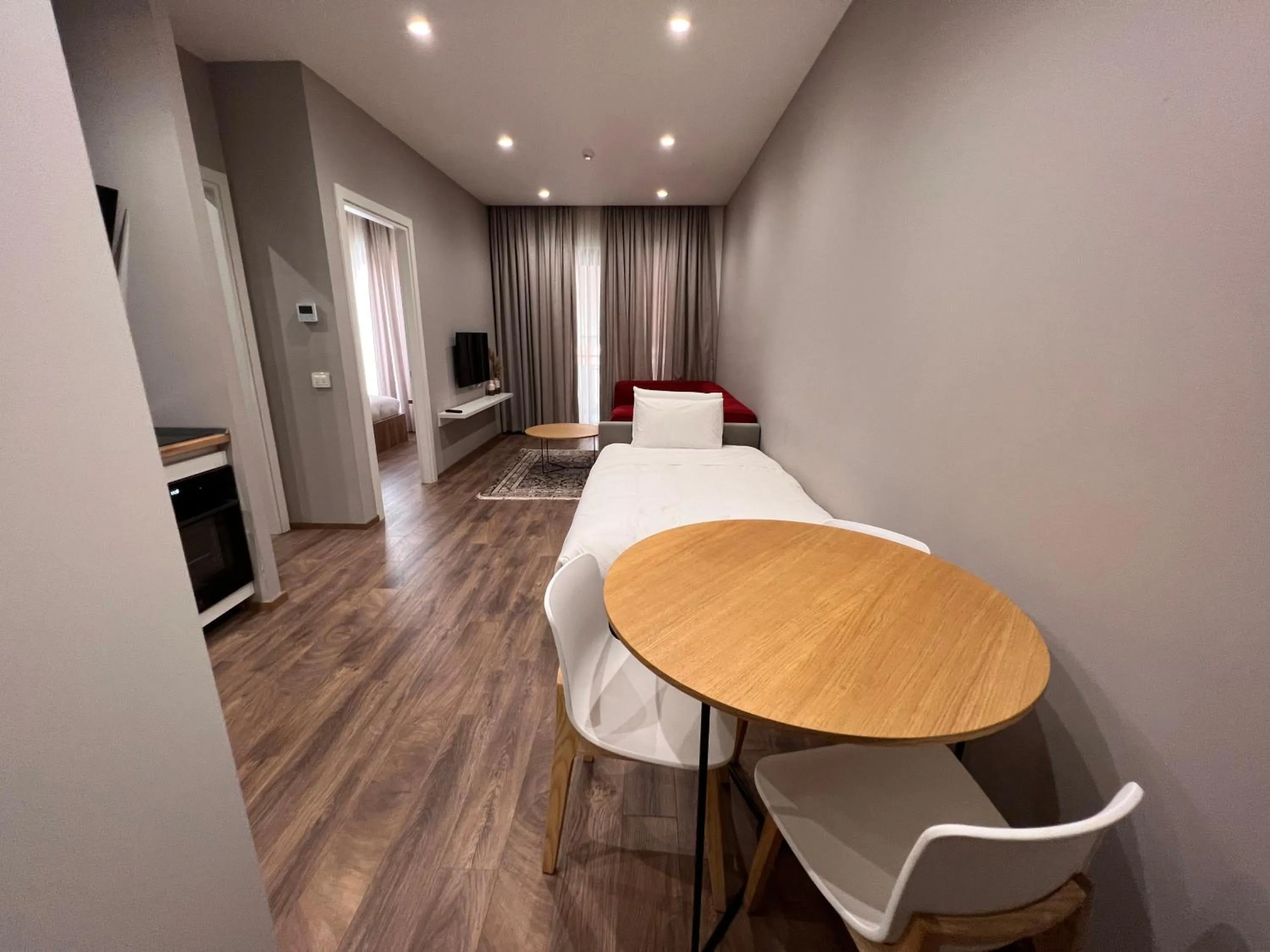 Living room, Bed in Habitat Hotel Tirana