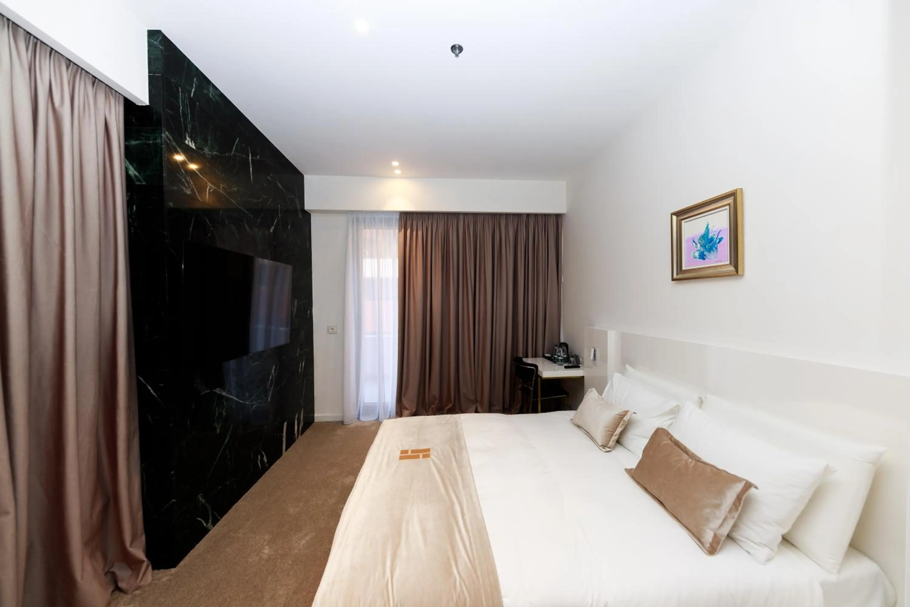 Communal lounge/ TV room, Bed in Habitat Hotel Tirana