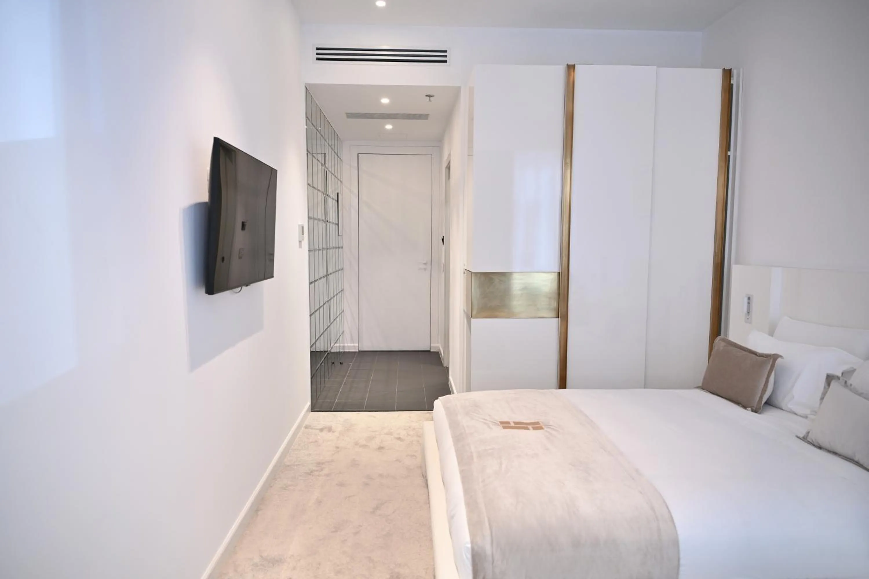 Communal lounge/ TV room, Bed in Habitat Hotel Tirana