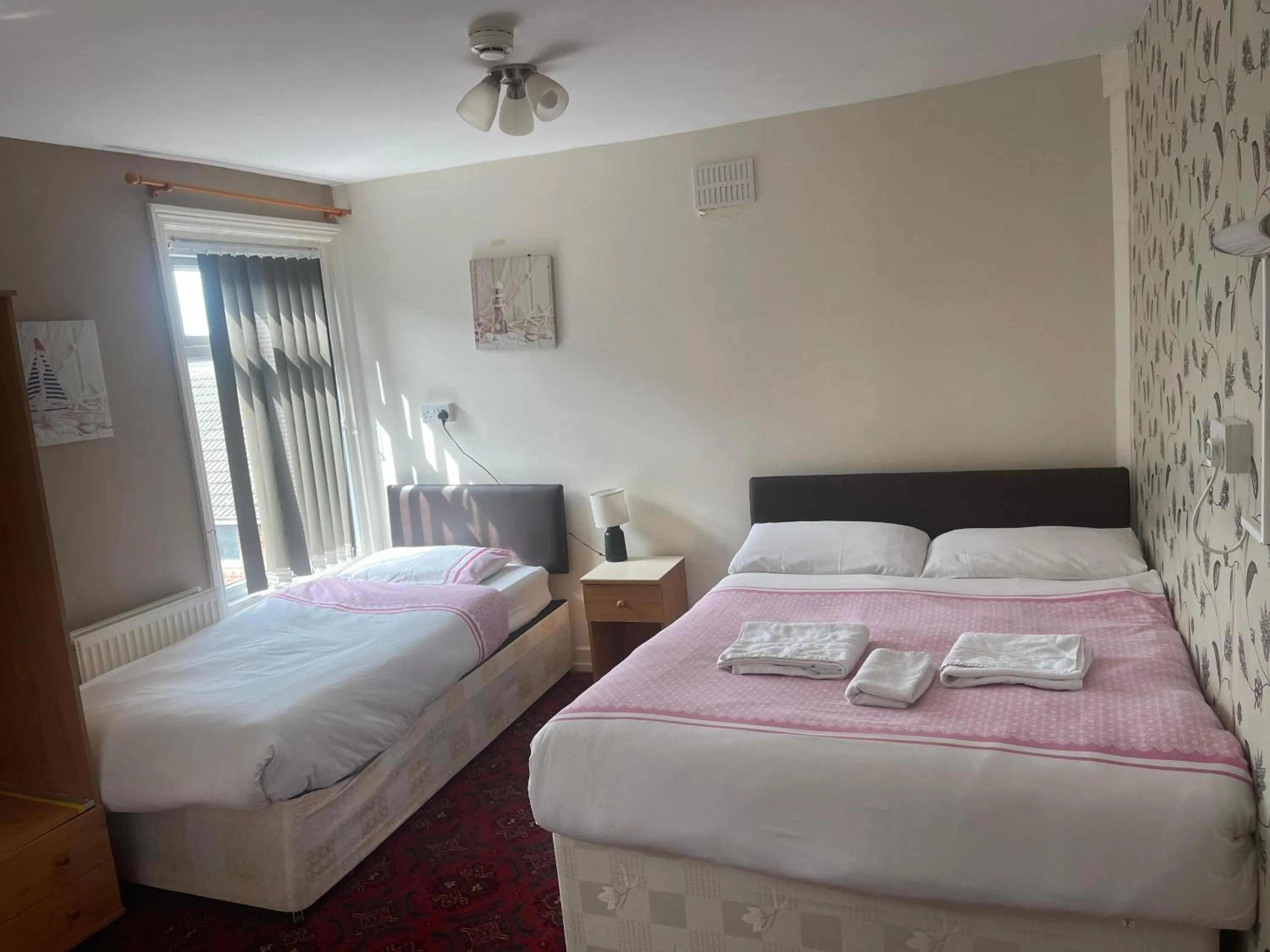 Bed in White Moon Hotel