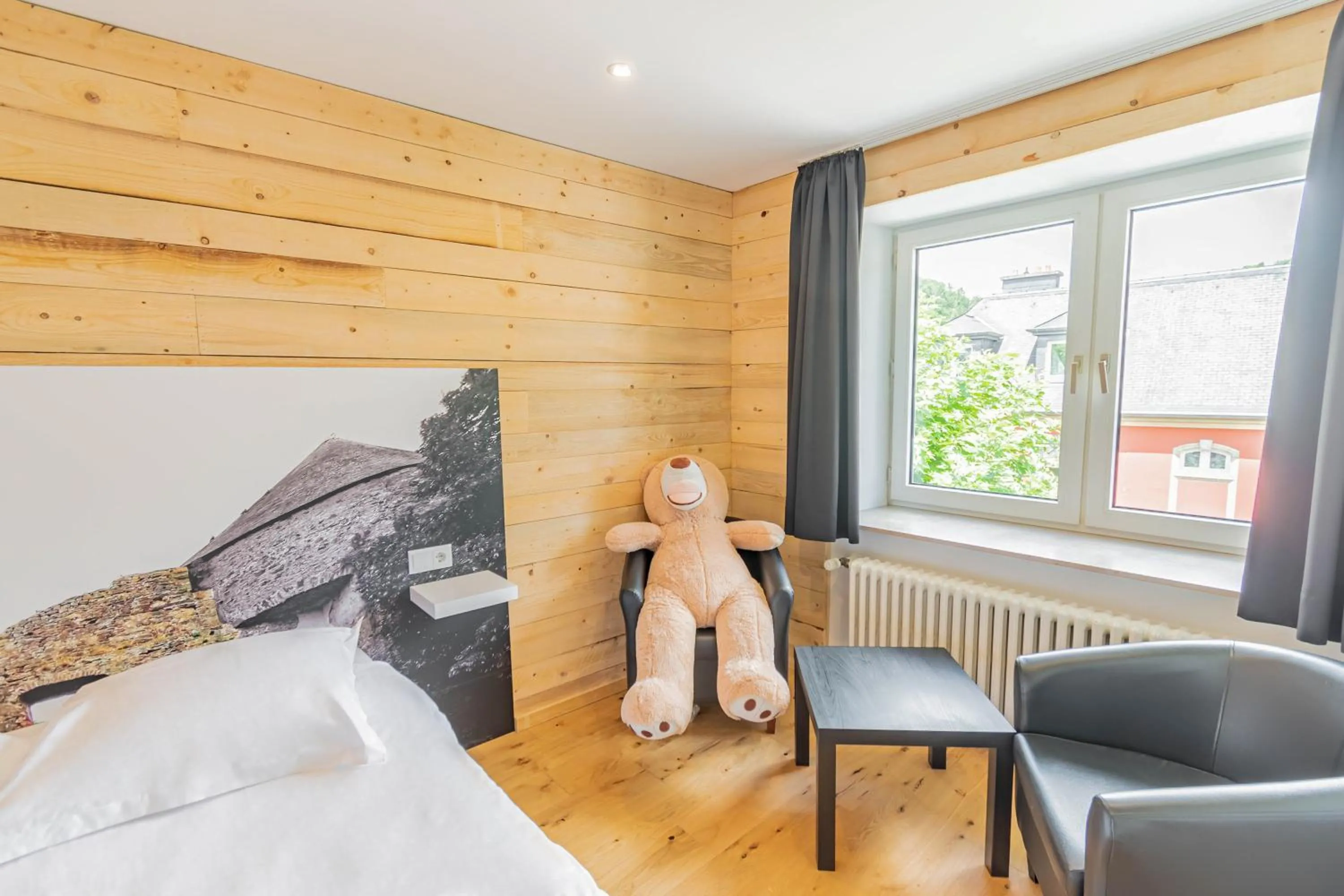 Seating area, Bed in Esplanade Hotel