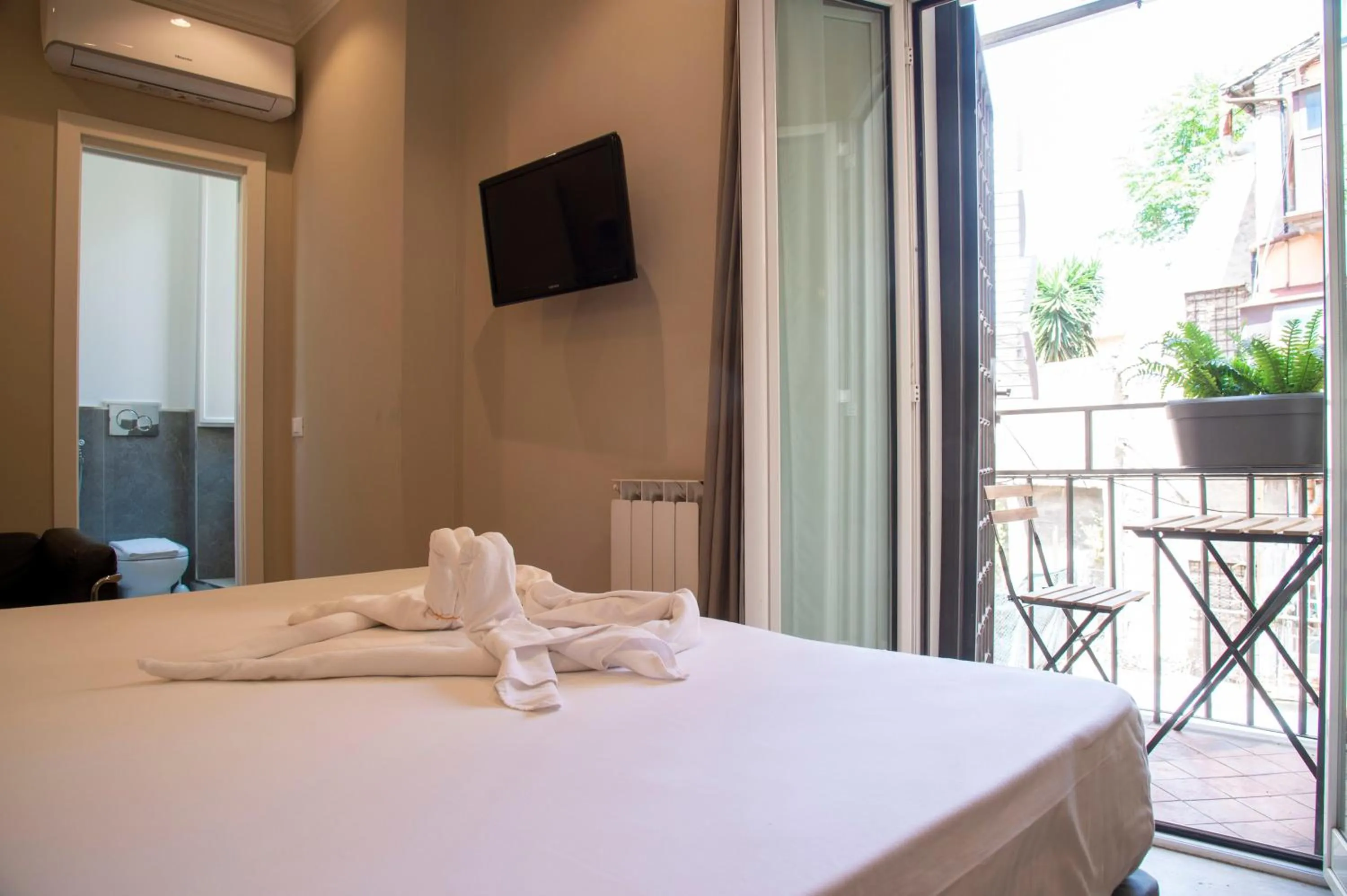 Bed in AD Suites Tritone